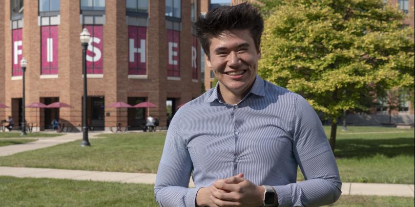 David McGrath outside on Fisher's campus with Mason Hall in background