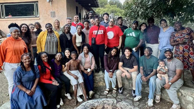 Ohio State students in different clothes pose for a group photo outside in South Africa