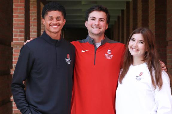 Smiling Fisher students standing next to each other.