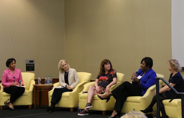 Alumnae Paula Bennett, Camille Gibson, Angel Harris and Kara Trott participate in a panel discussion.