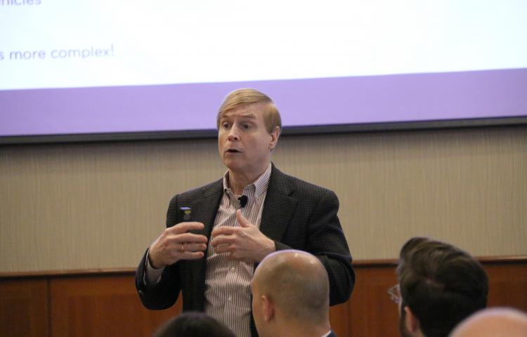 Russ Klein on stage leading a discussion