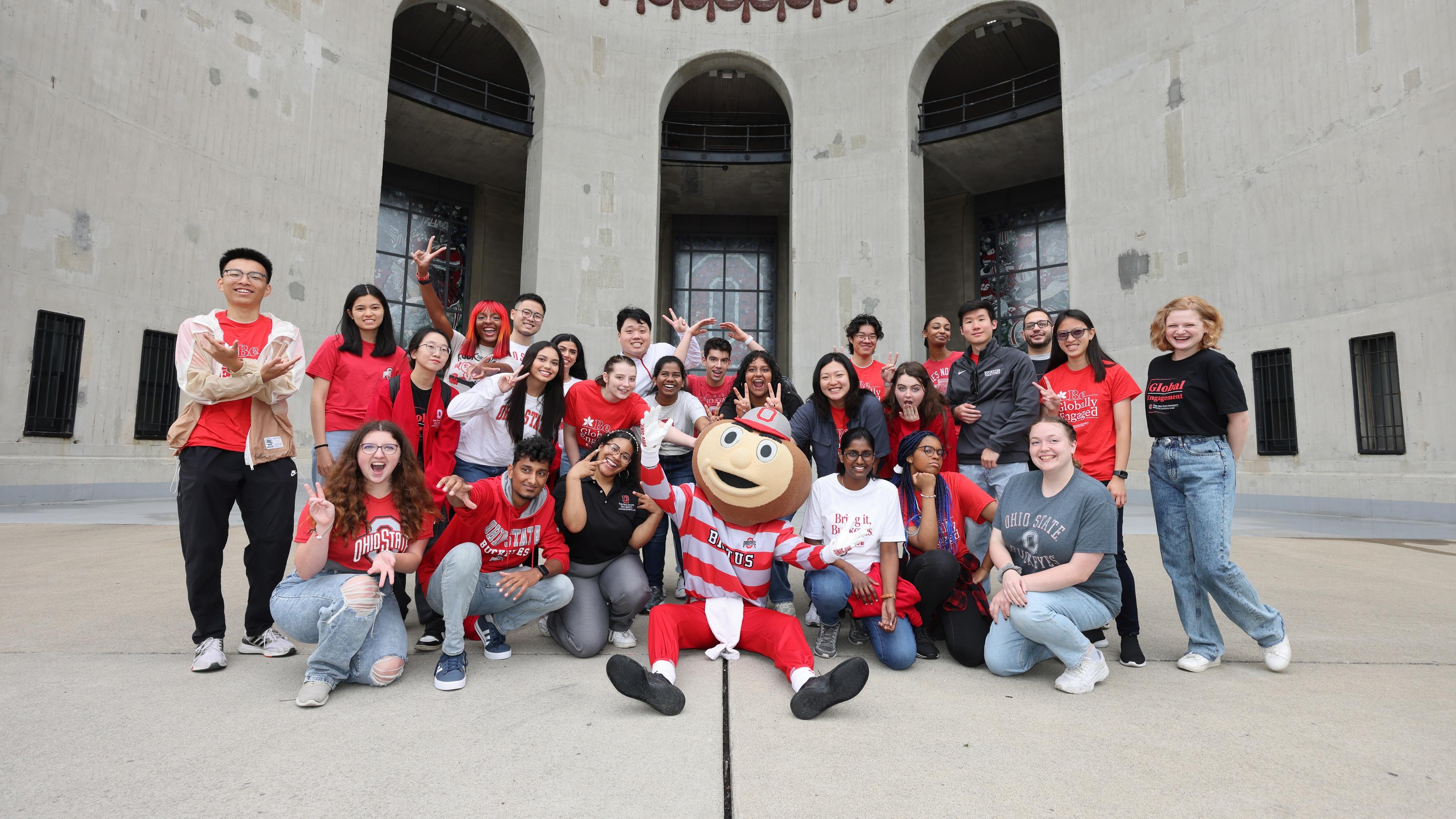 group photo of Ohio State students with Brutus Buckeye in front of The Shoe