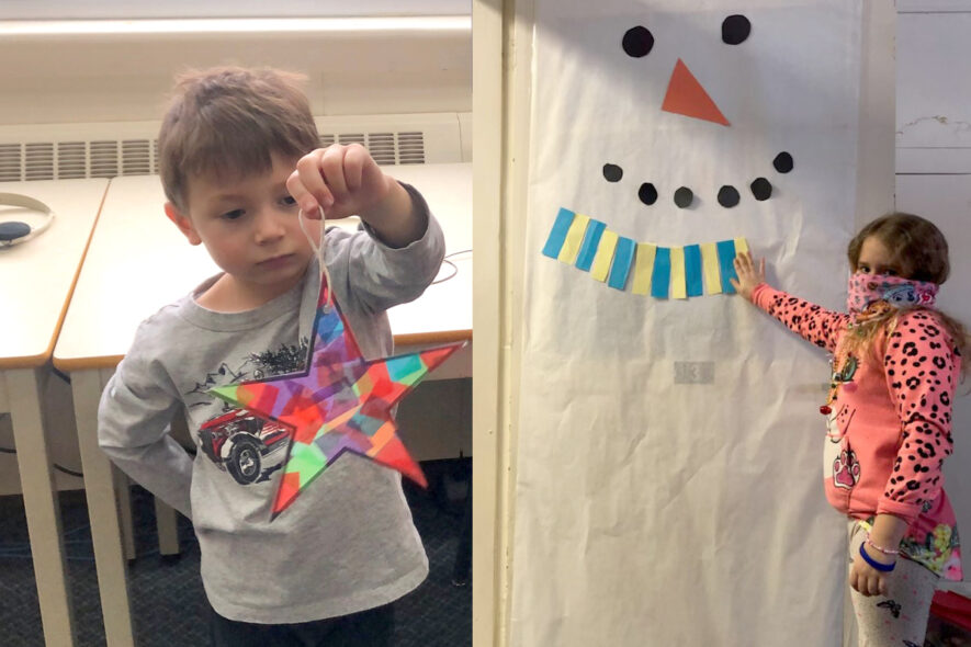 Nicholas McLoad examine de près son capteur de soleil de Noël et Mia Monahan-Serré fait la démonstration du décor d’une porte de classe presque complété. — Photos : Courtoisie