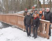 In front of the new pedestrian bridge, at the J. Henry Tweed Conservation Area, near the Village of Russell, are (left to right): John Sanna of Ontario Power Generation (left), Russell Township Councillor Cindy Saucier, Phil Duncan of South Nation Conservation Authority (SNC) on the bridge (left), Celine Guitard of Russell Township, Mike Leger, Pat Piitz, and Caroline Goulet, all of SNC, Kevin Bird of Russell Township, and past-chairman SNC Board of Directors Doug Thompson. The December 5 gathering highlighted various improvements to the recreation site, including shoreline work to deal with creek erosion.  — supplied photo