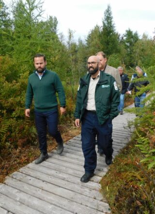 Ontario Environment Minister David Piccini (right) strolls along the Alfred Bog Boardwalk during a Thursday afternoon visit to Alfred-Plantagenet Township. The minister announced the official designation of the local natural heritage site as a non-operational provincial park, dedicated to protecting a unique wildlife habitat in Ontario. — photo Gregg Chamberlain