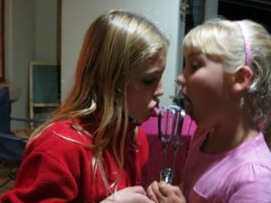 Debrianna and Alayna licking the beaters :-)