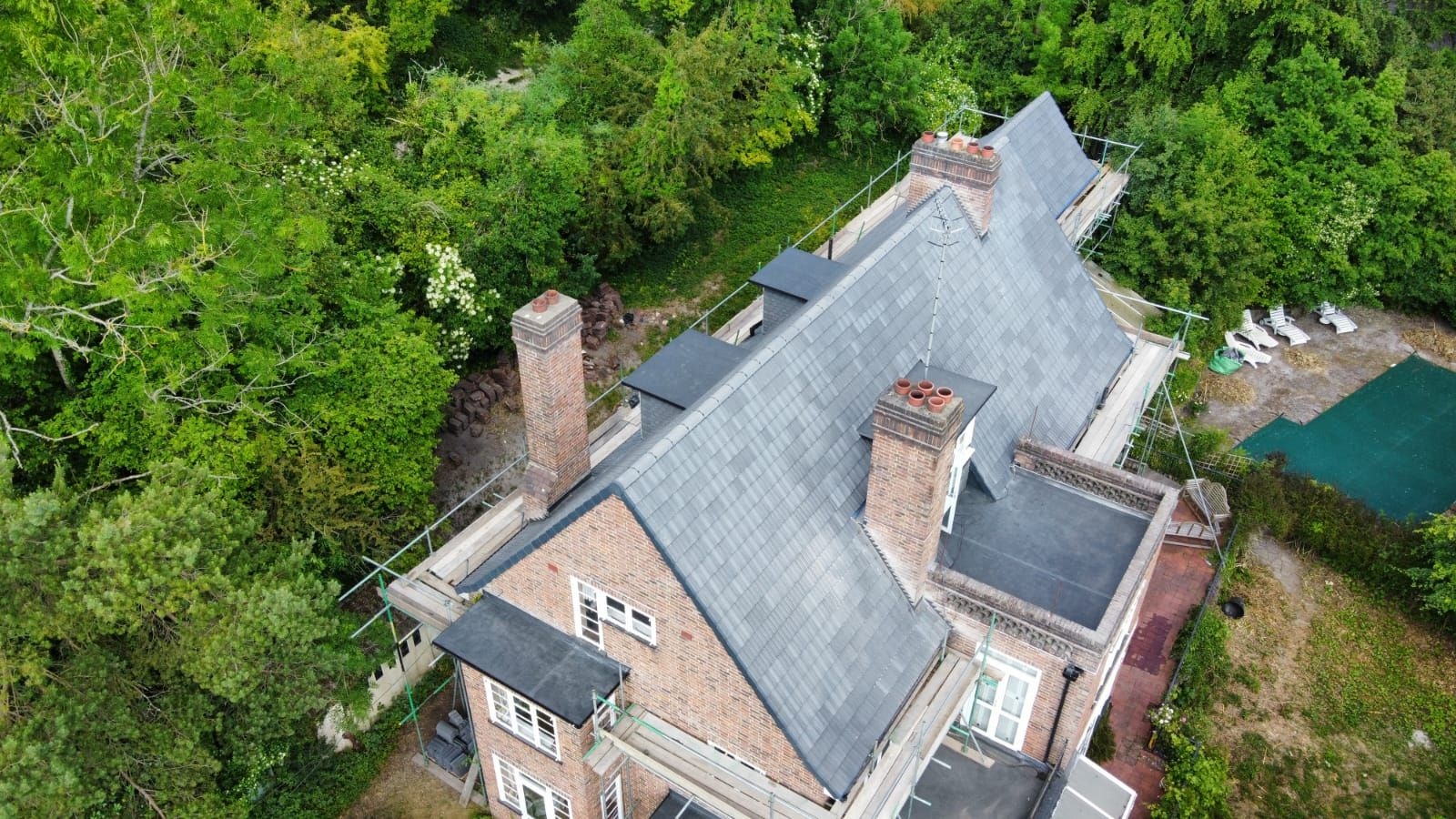 How can I maintain my gutters between cleanings?