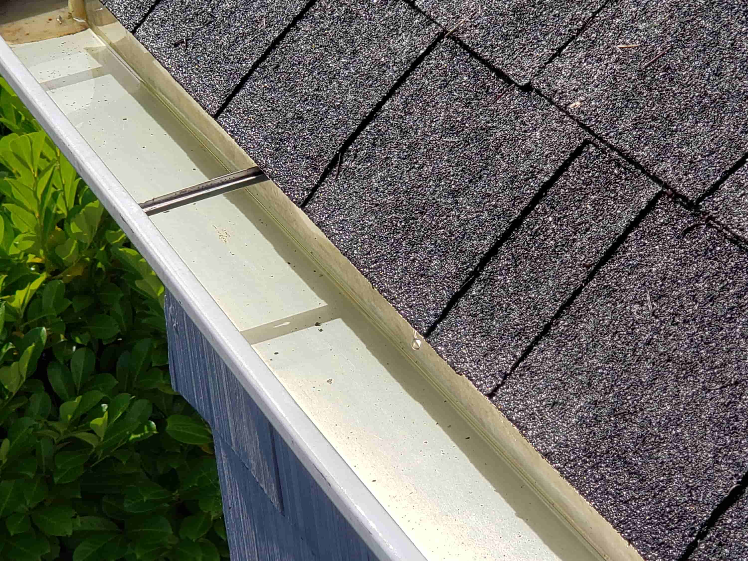 how to clean gutters with guards