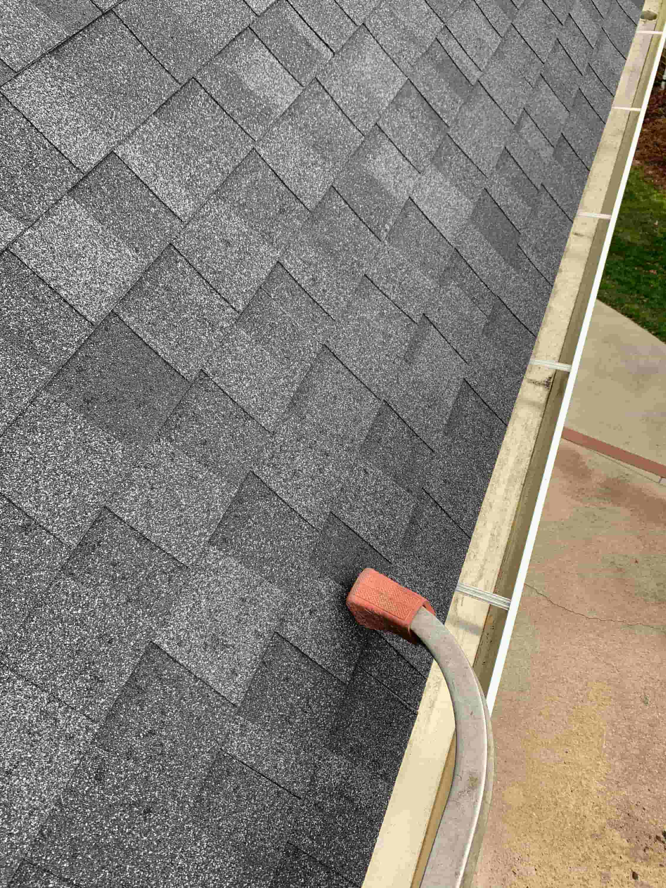 cleaning gutters with gutter guards