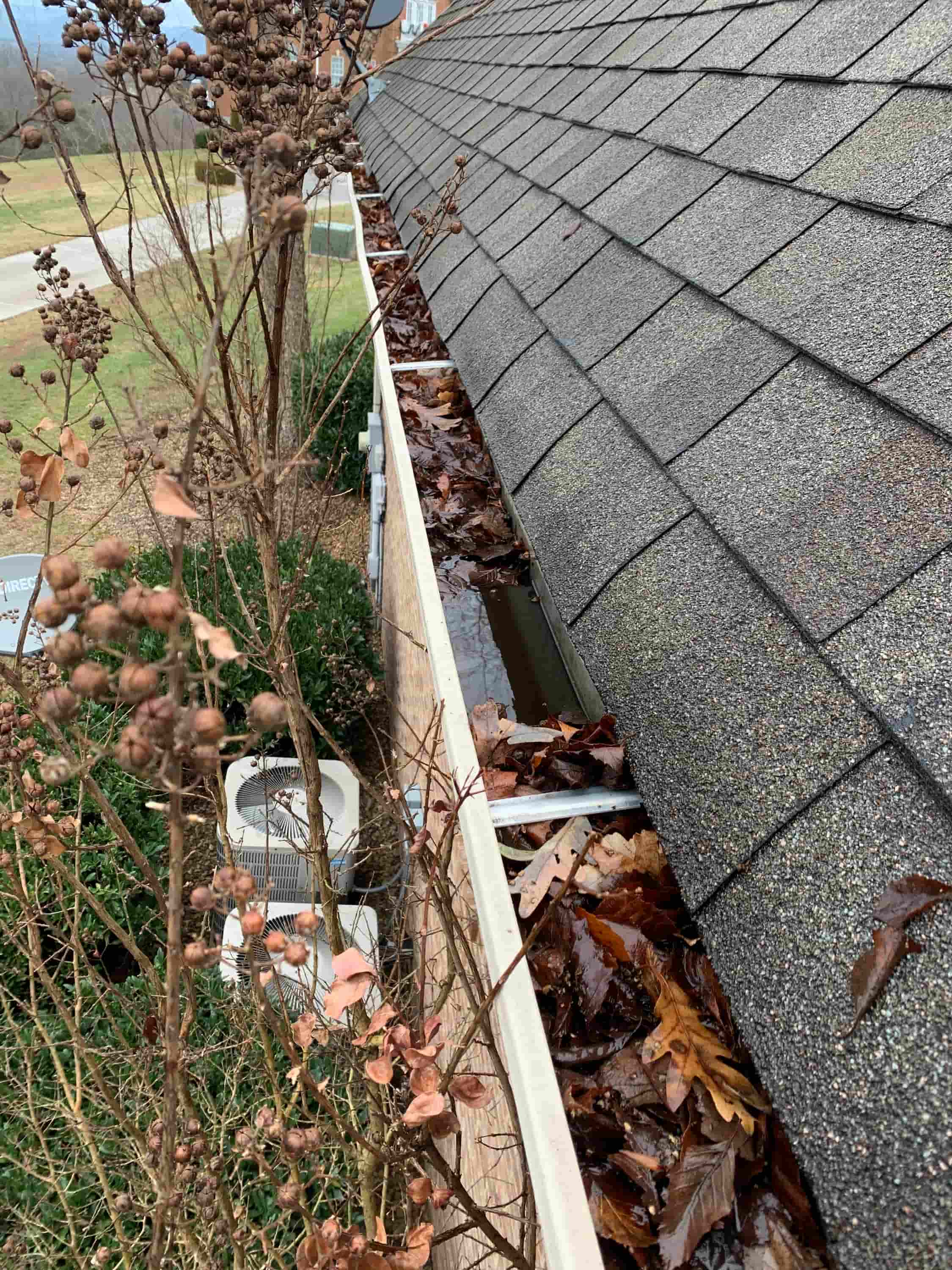 clean gutter downspout from ground
