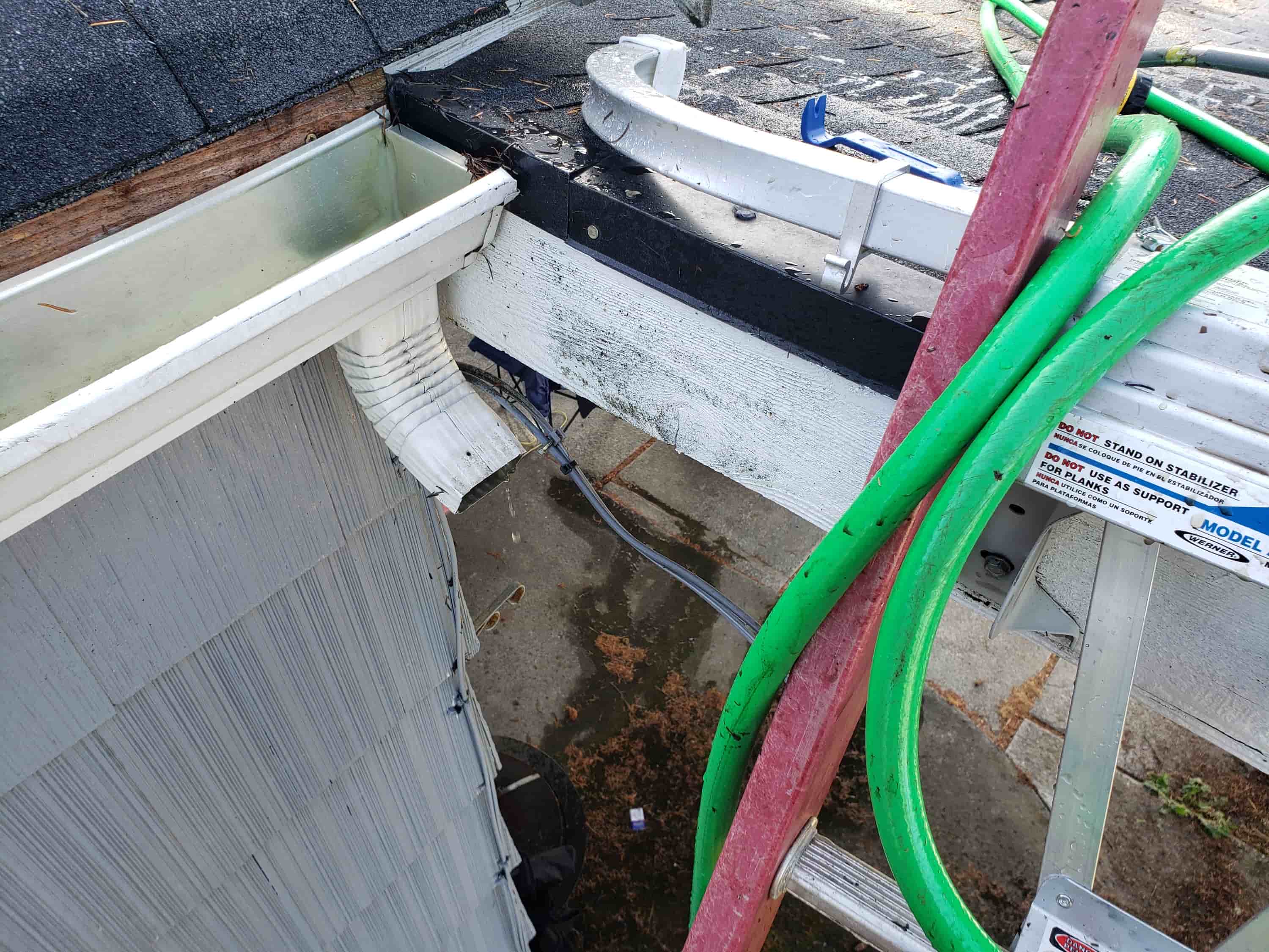 cleaning out rain gutters