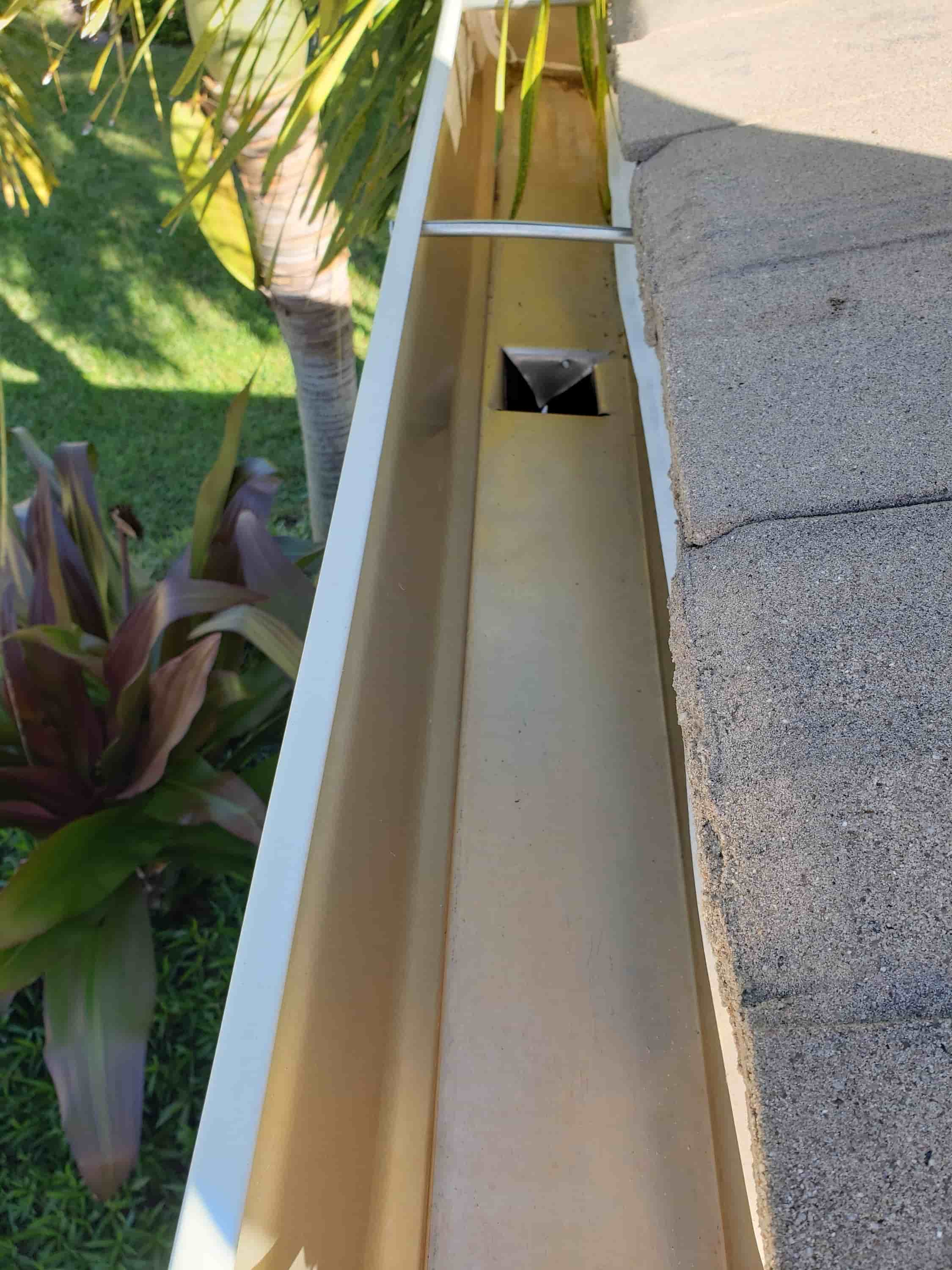 how to clean gutters and downspouts