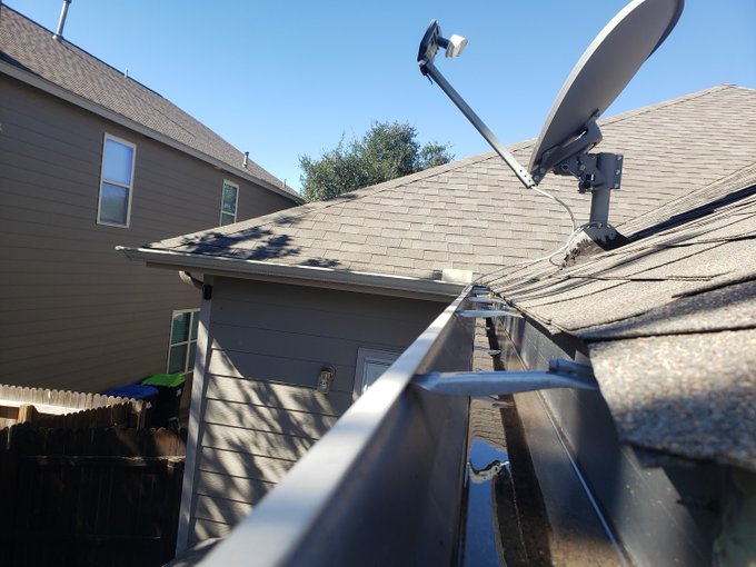 cleaning gutters above conservatory