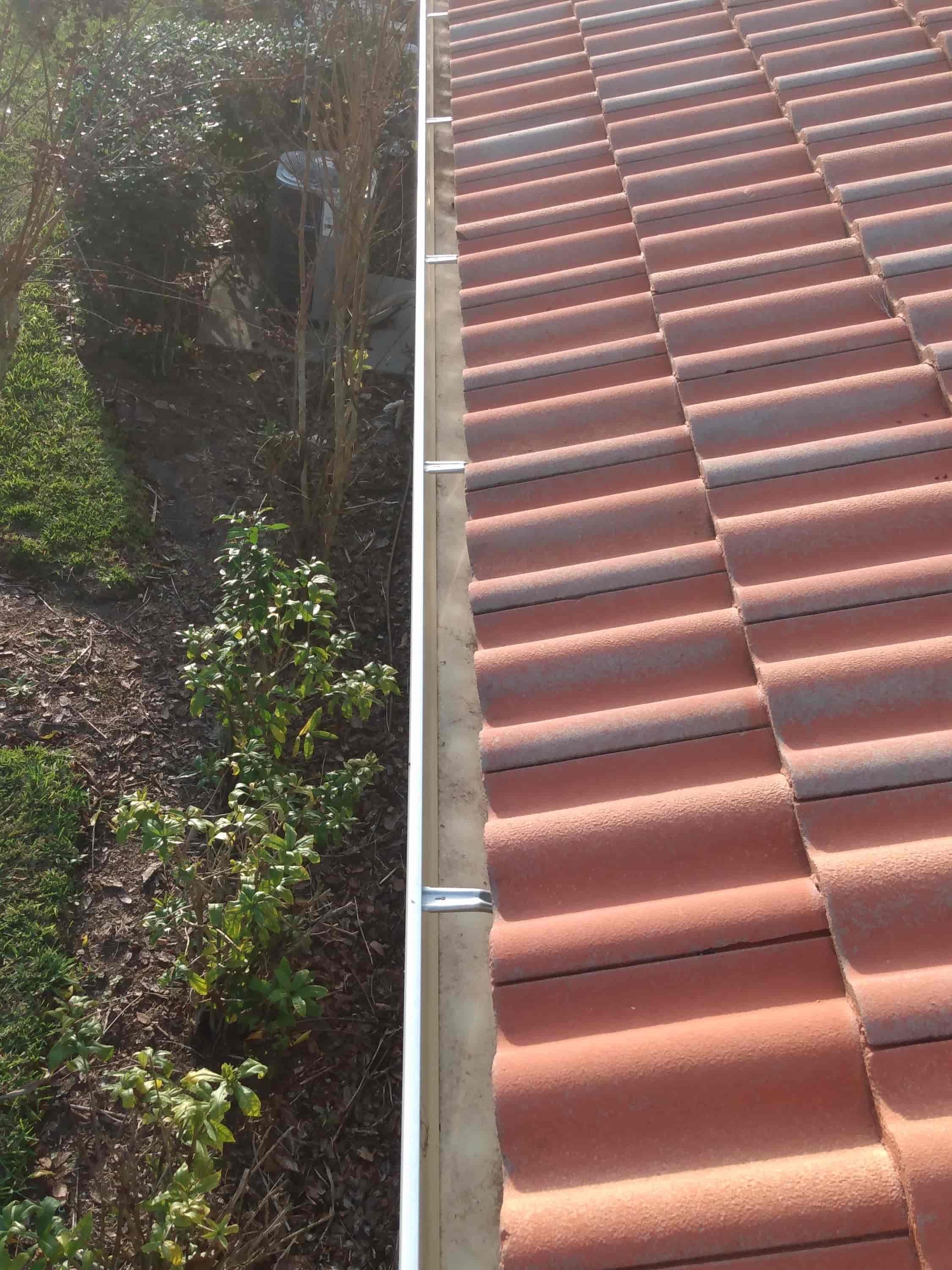 how to clean clogged gutters