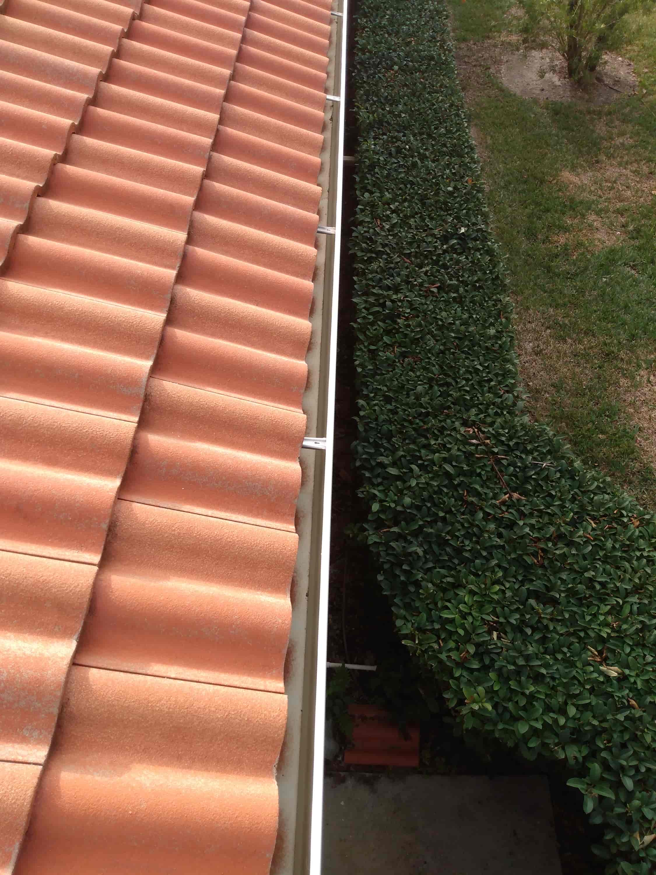 cleaning gutters above conservatory