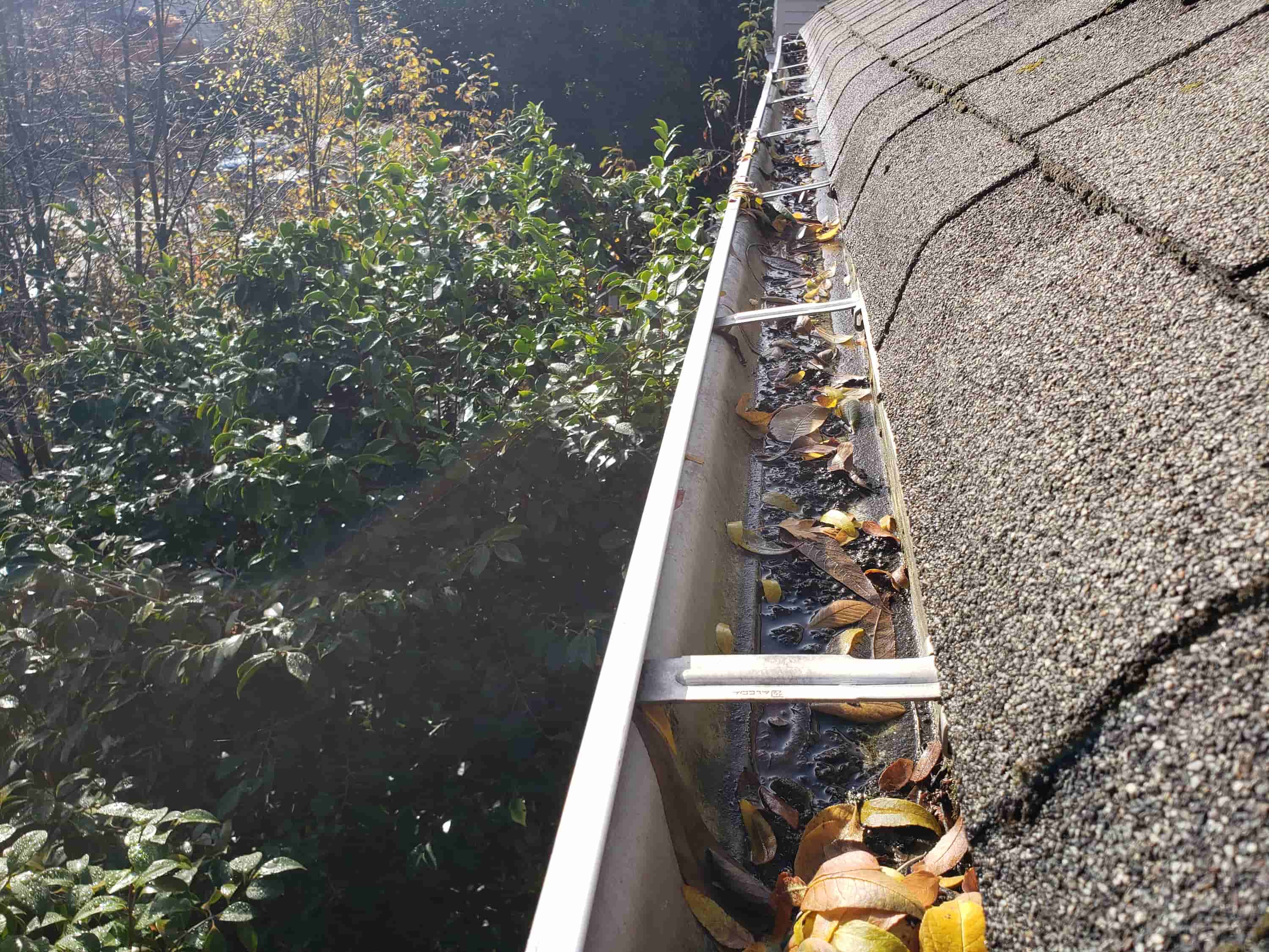 how to clean gutters with covers