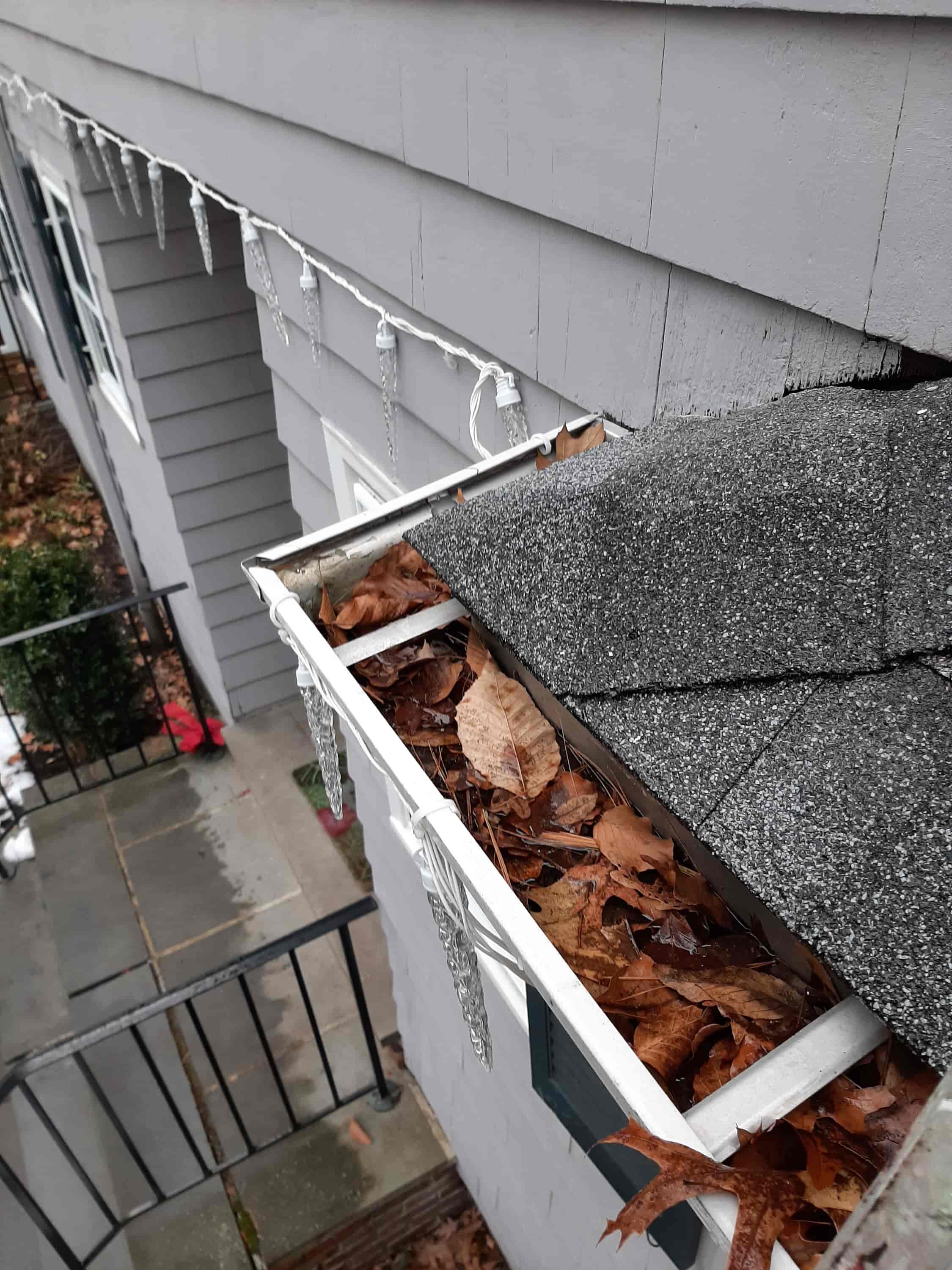 cleaning eaves of roof