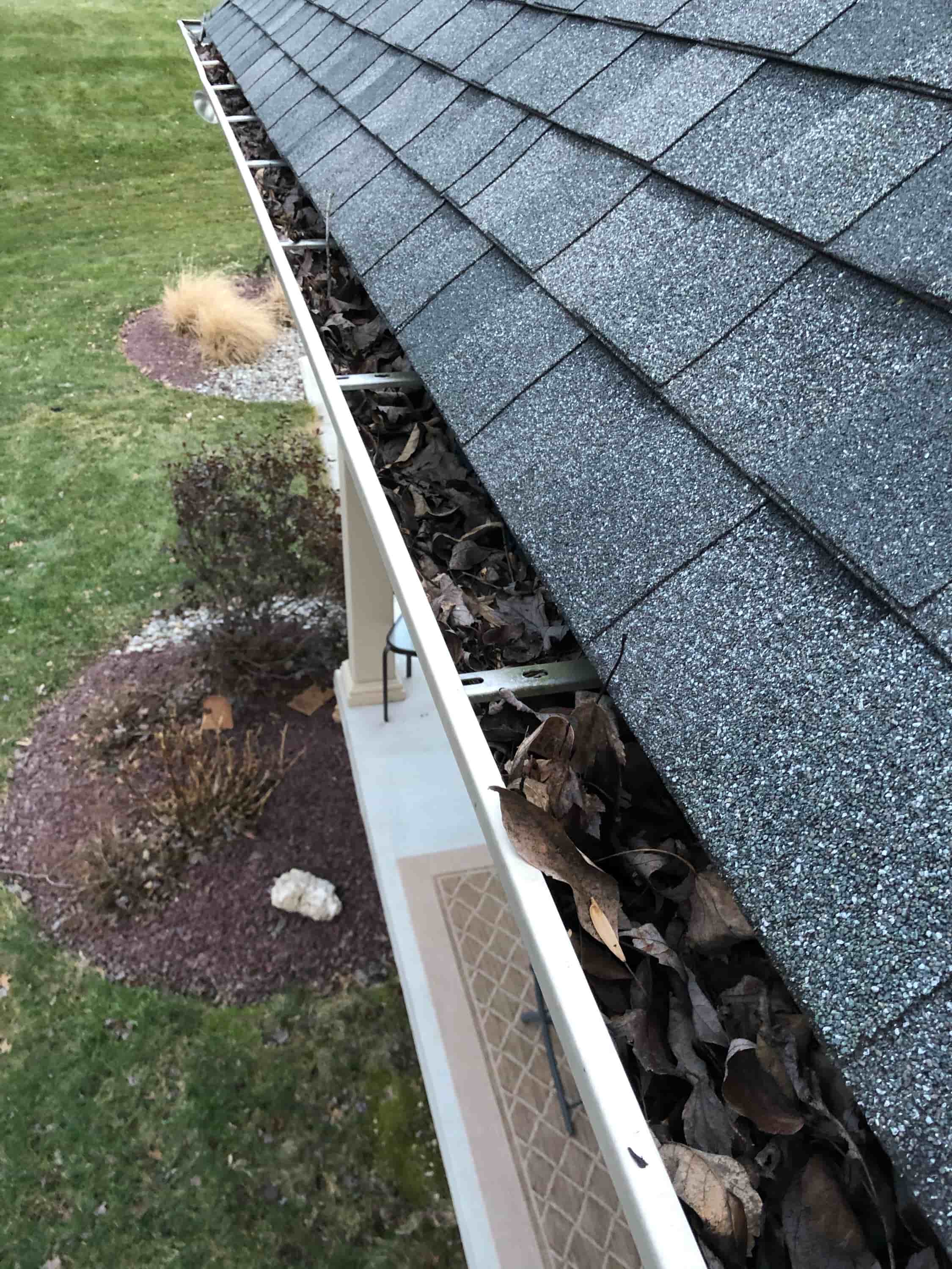 clean gutter with pressure washer