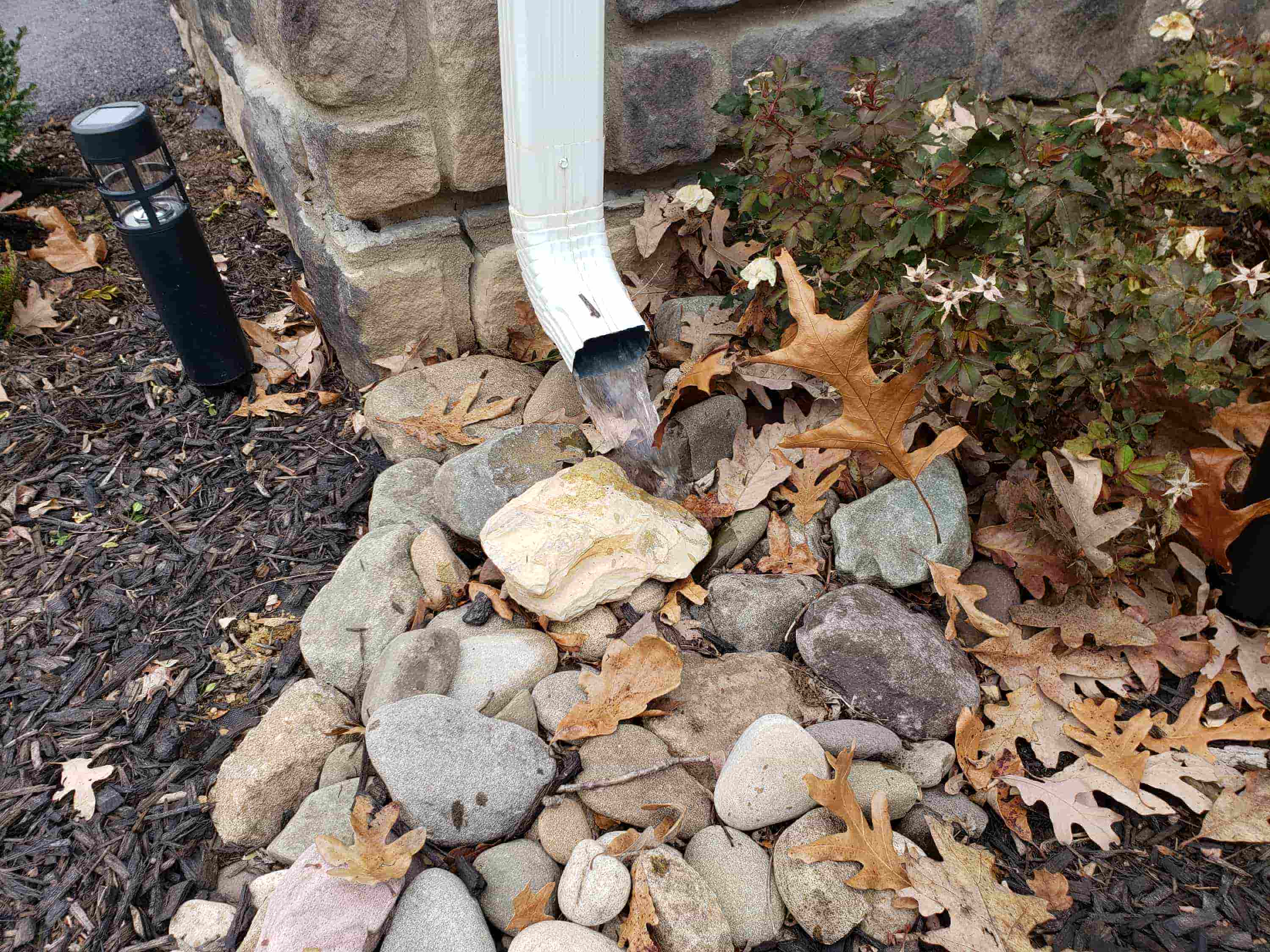 cleaning gutter downspout