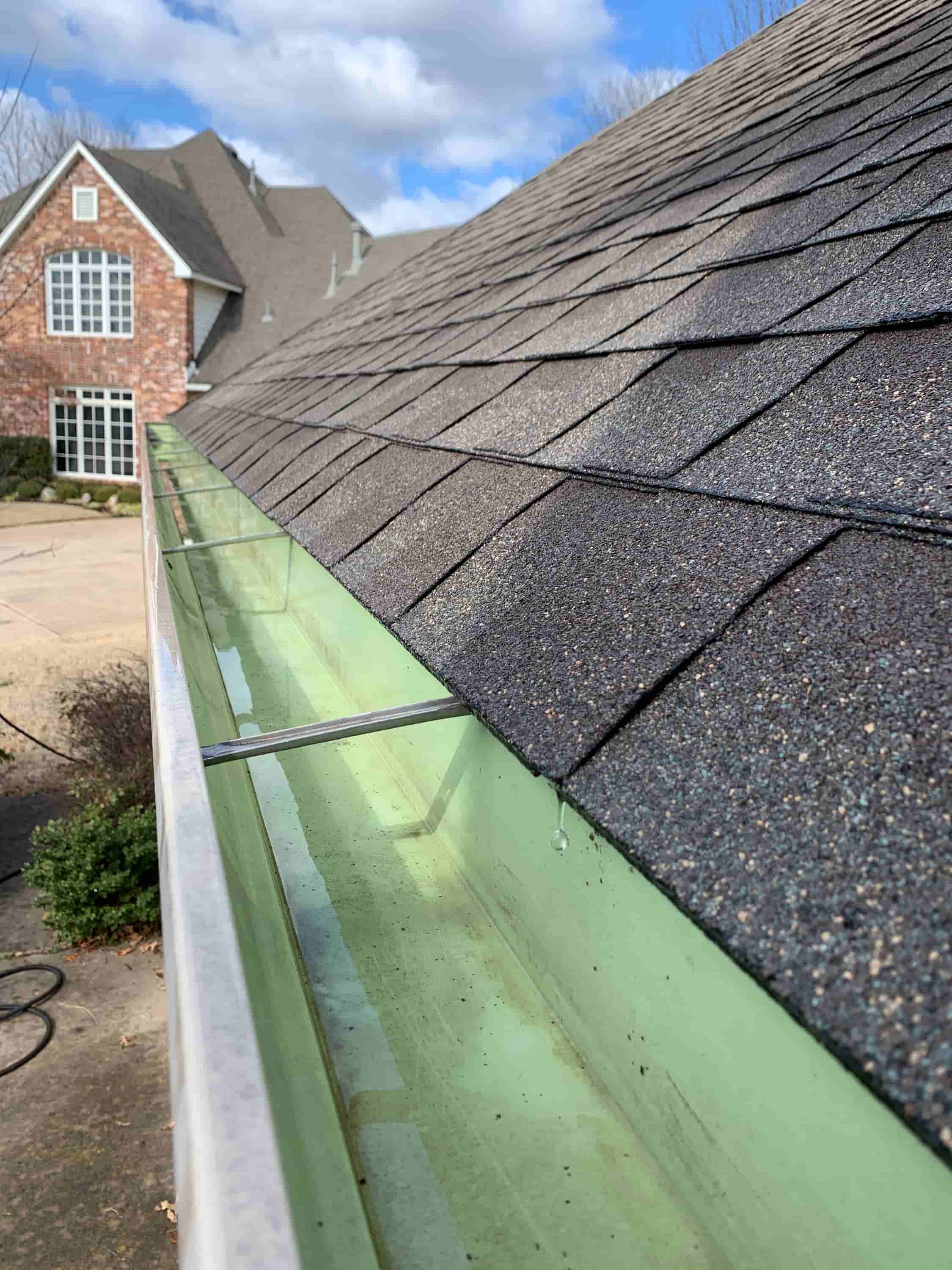 cleaning out gutter downspouts