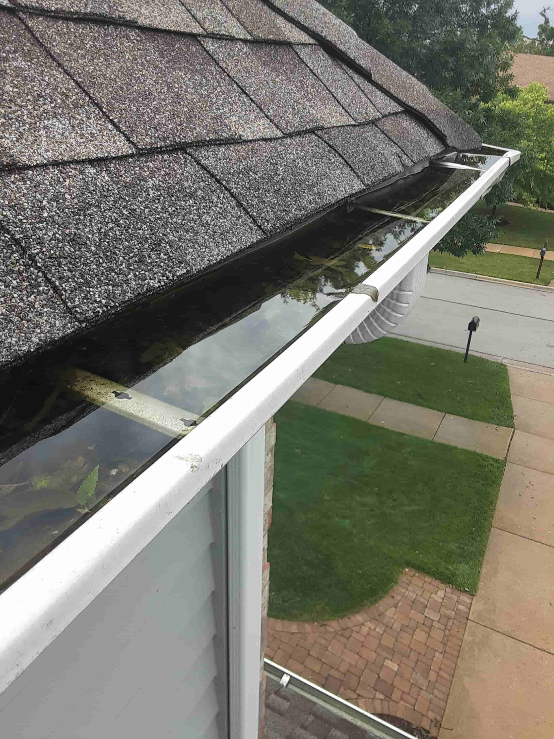 cleaning out gutter downspouts