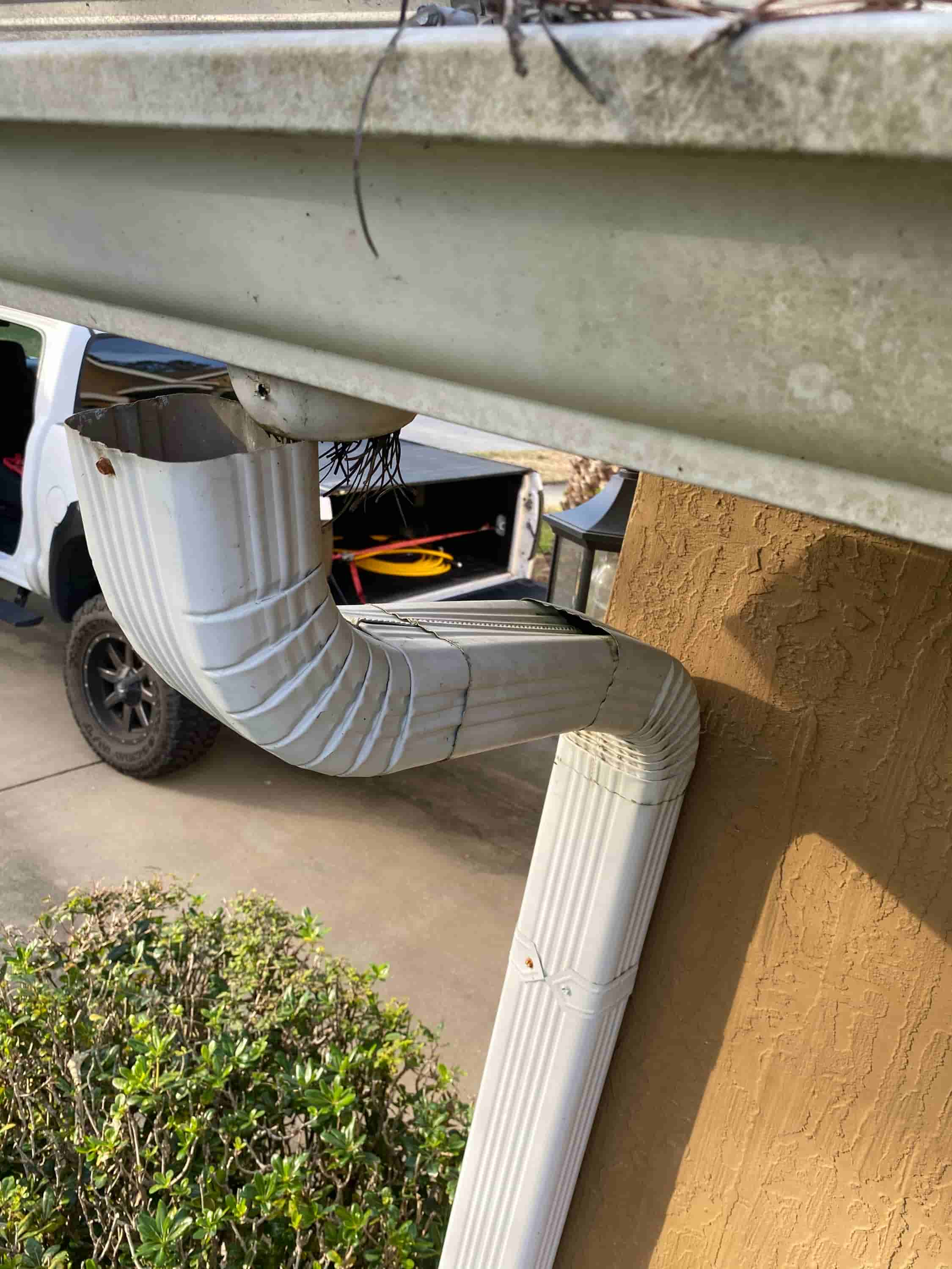 how to clean out gutter downspouts