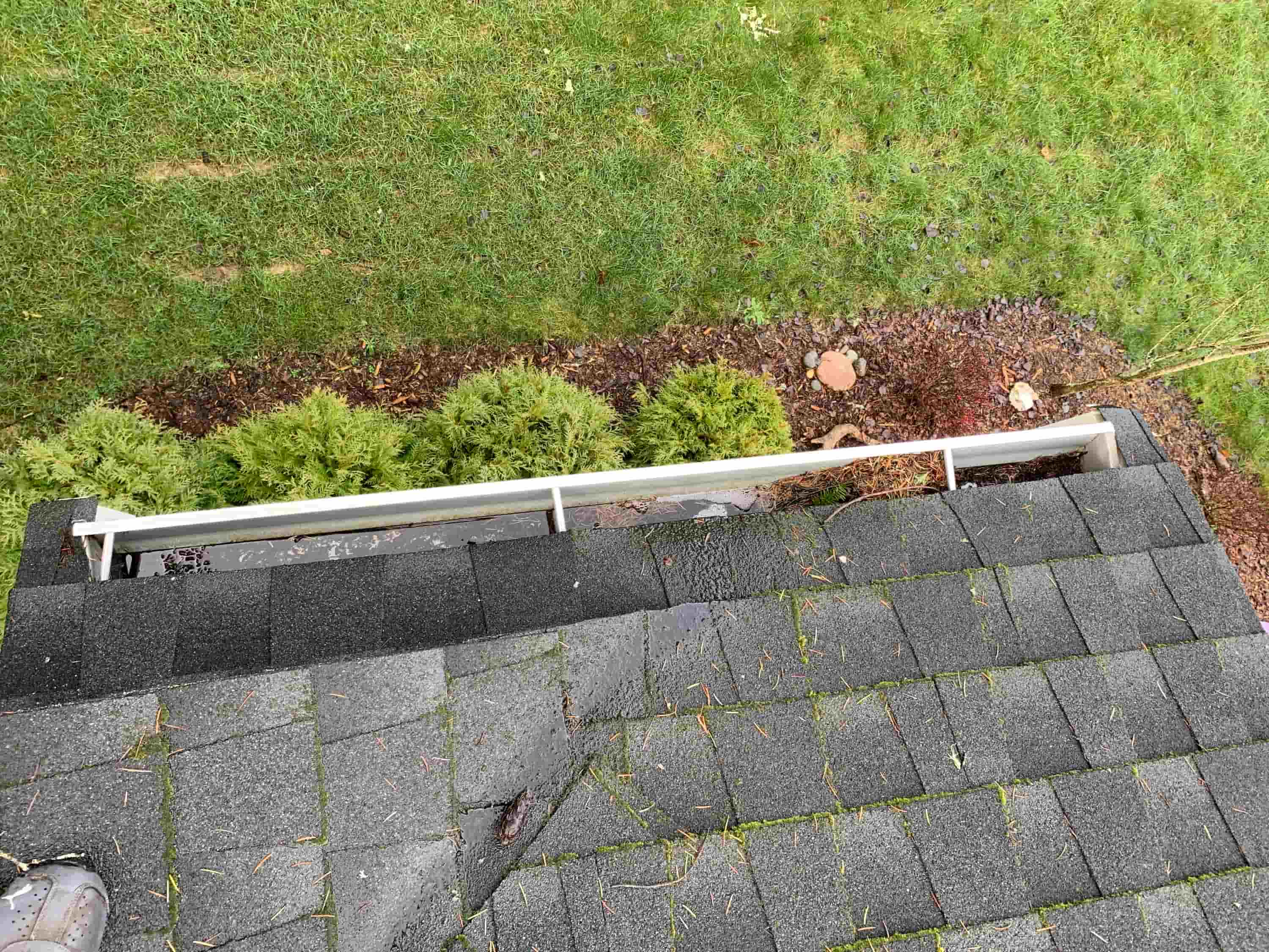 cleaning out gutter downspouts