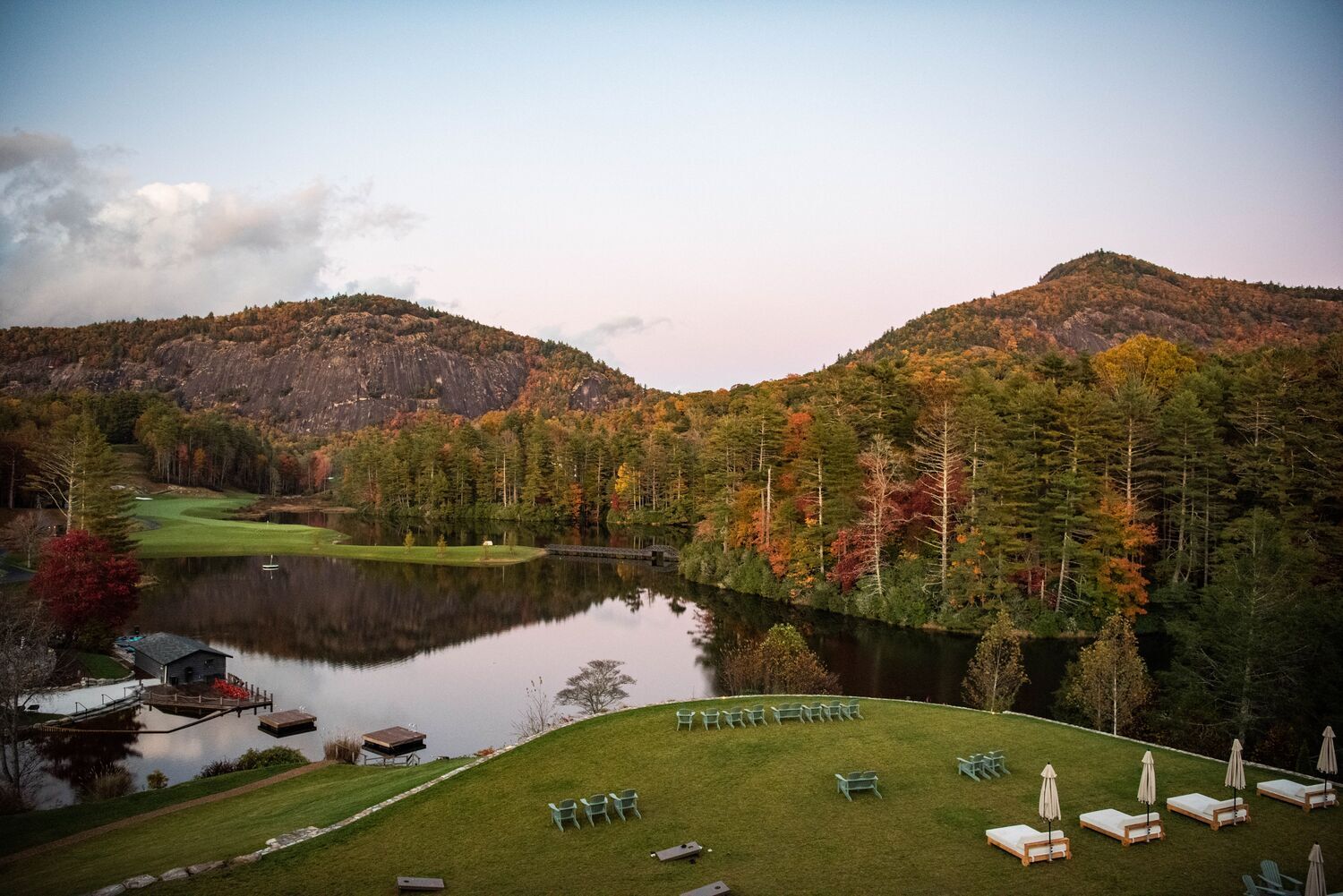 A photo of Hampton Lake in the Fall with cozy fall foliage.