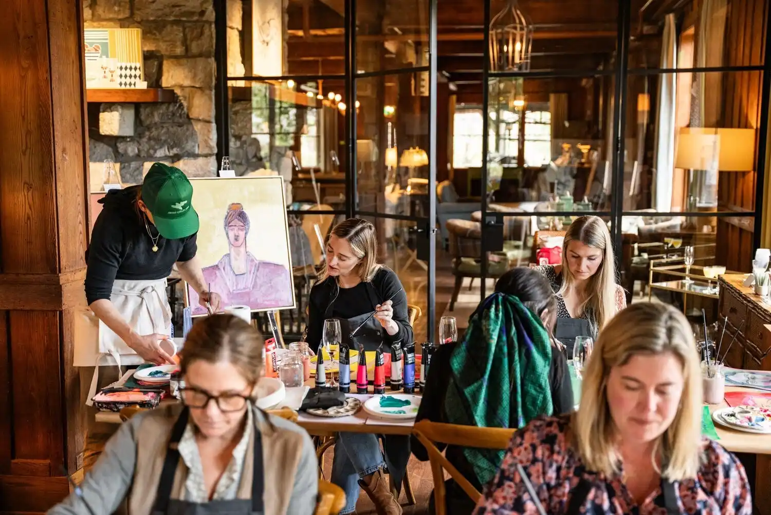 Artist leading a painting workshop