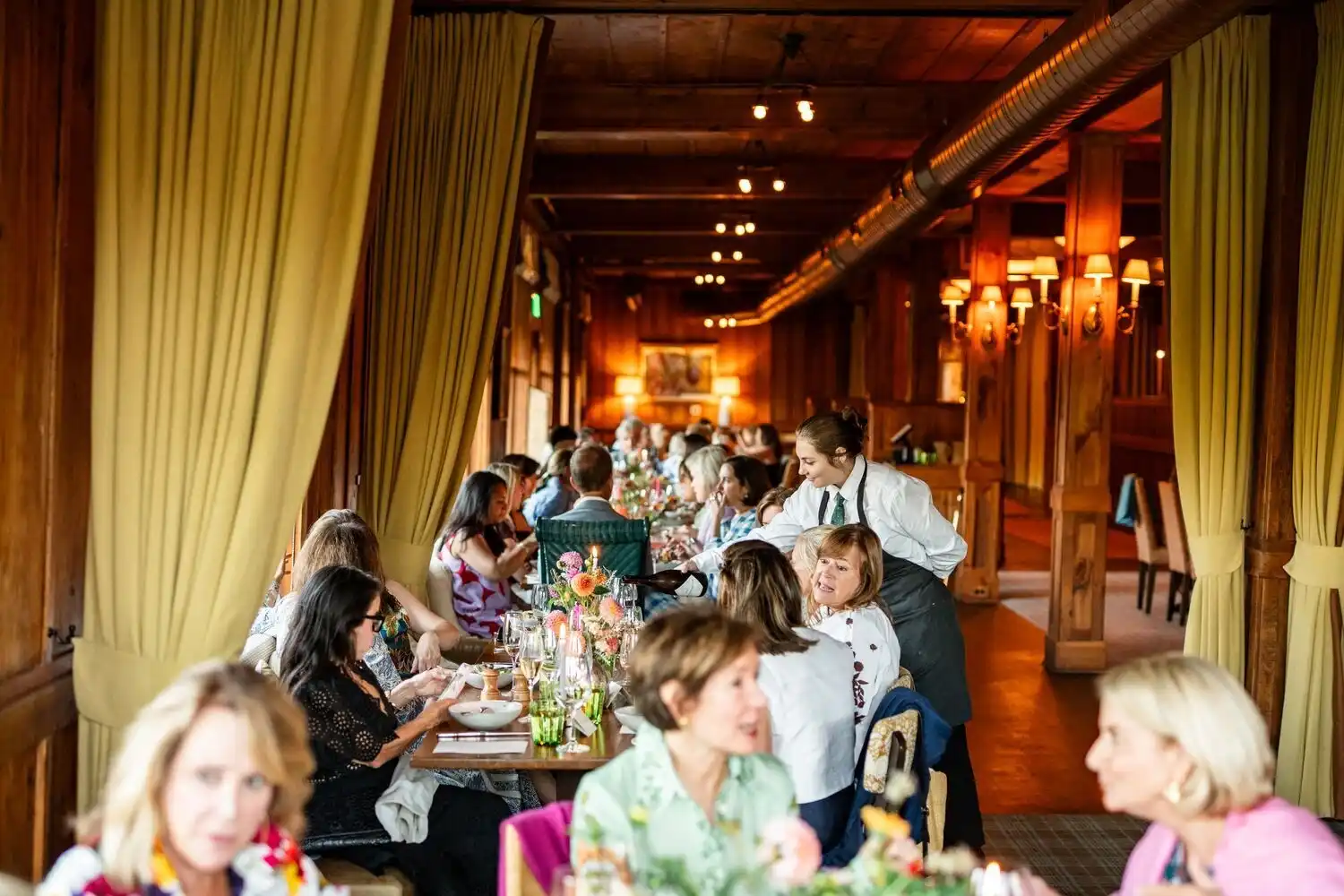 Server Serving Guests at Tables