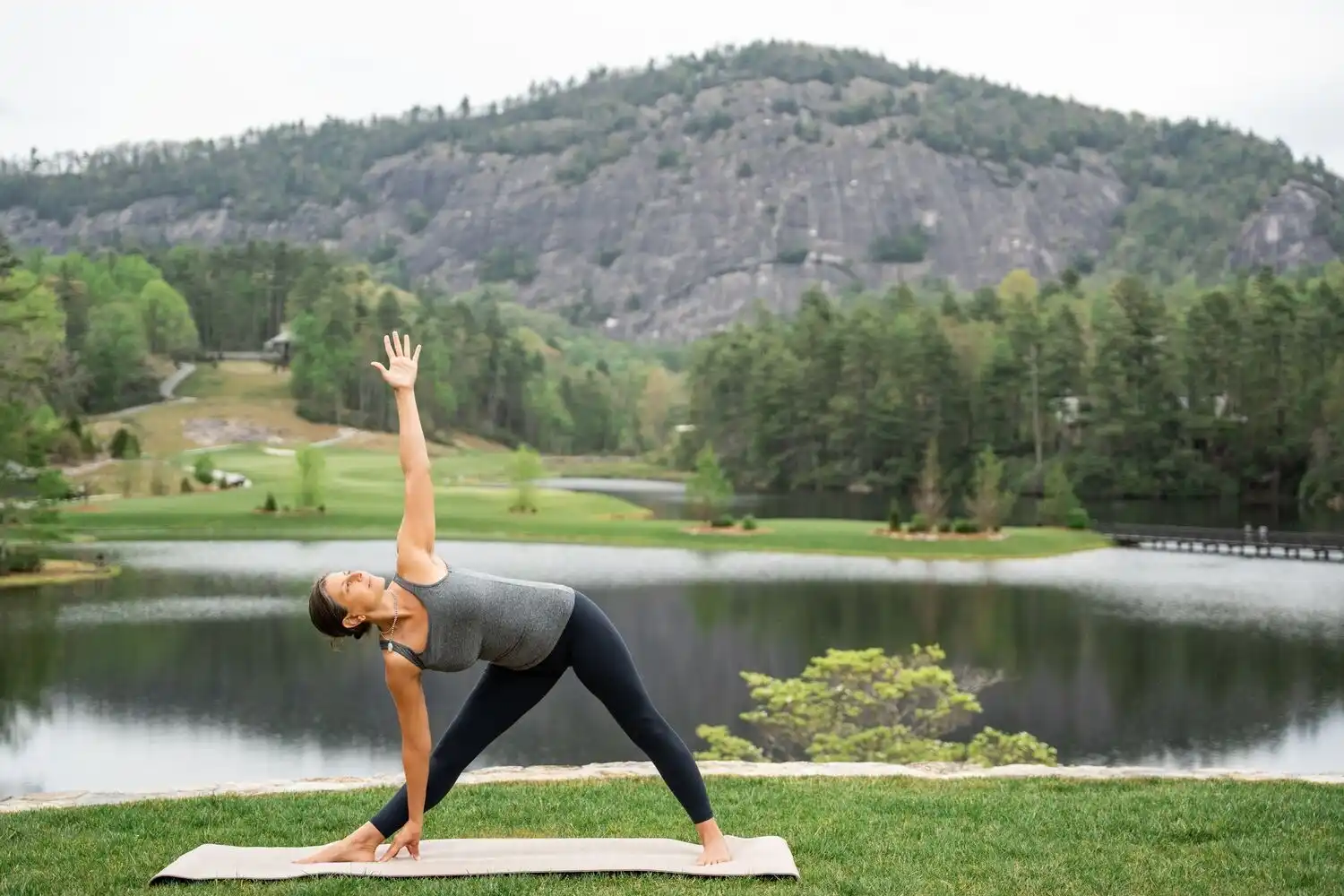 Woman Doing Yoga in Front of Rock Mountain
