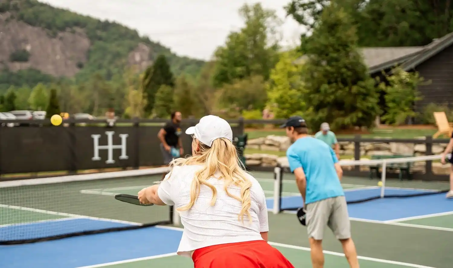 Back of Woman's Head Playing Pickleball