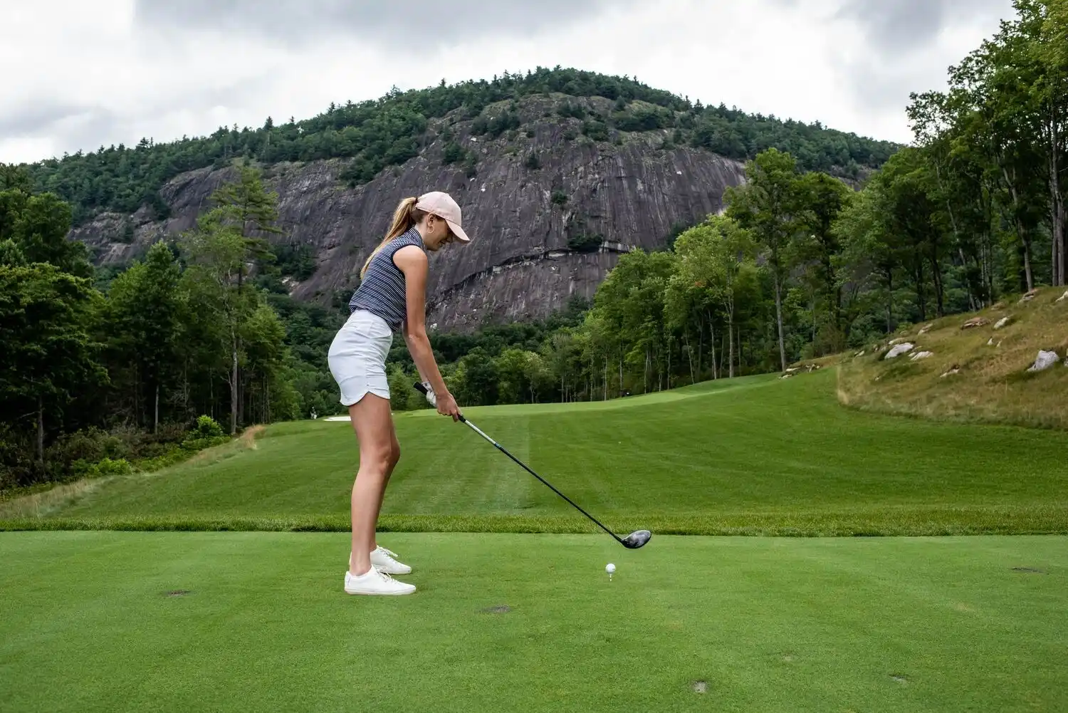 Woman Setting Up on Tee Box