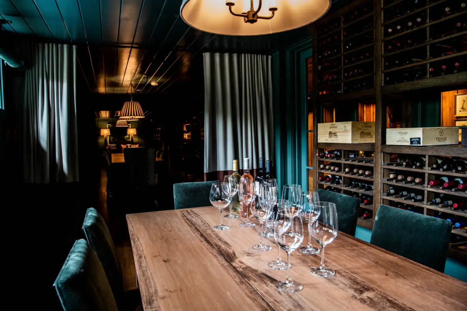 Wine glasses set up for tasting in a wine cellar