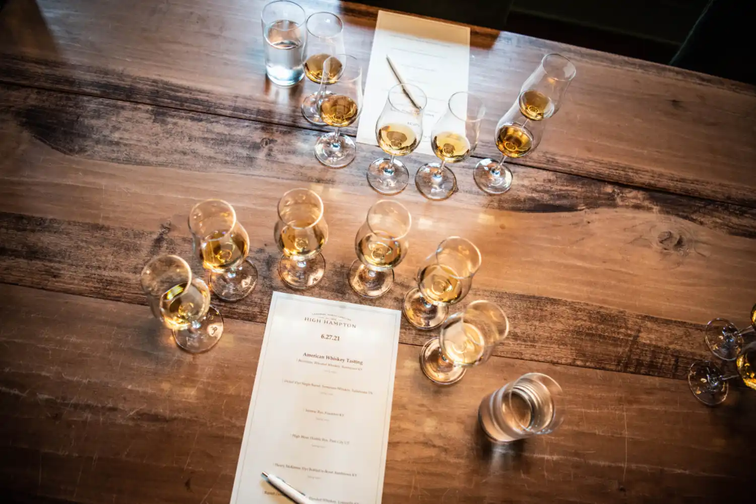 Whiskey glasses set up for tasting in a wine cellar