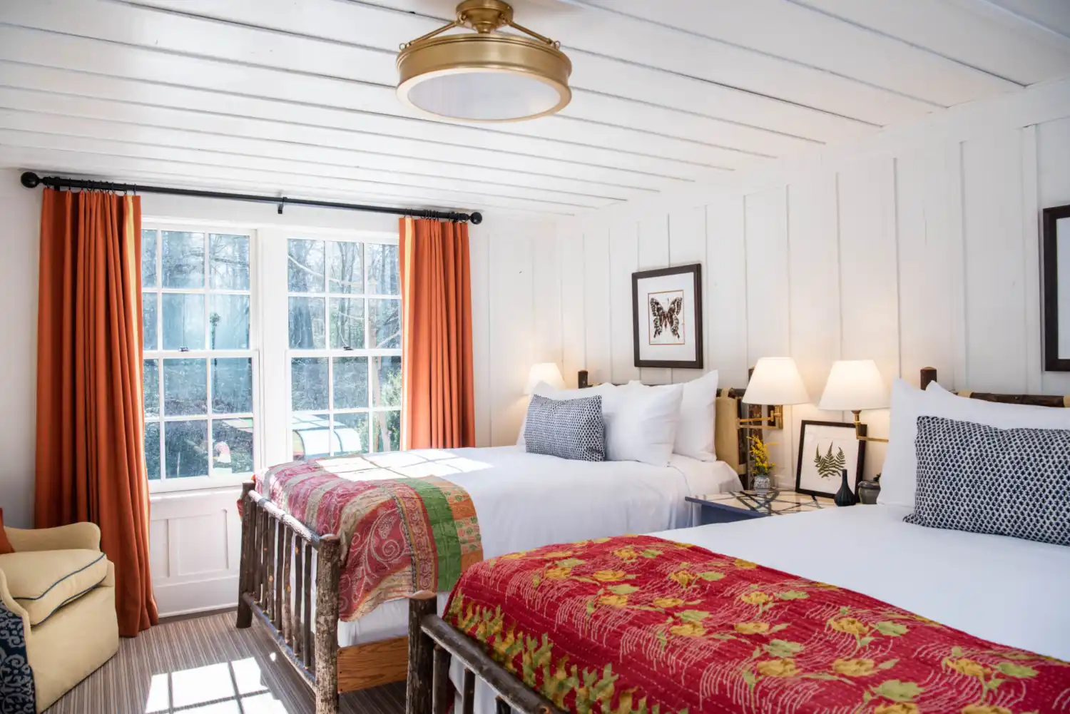 Two queen beds in a cottage room