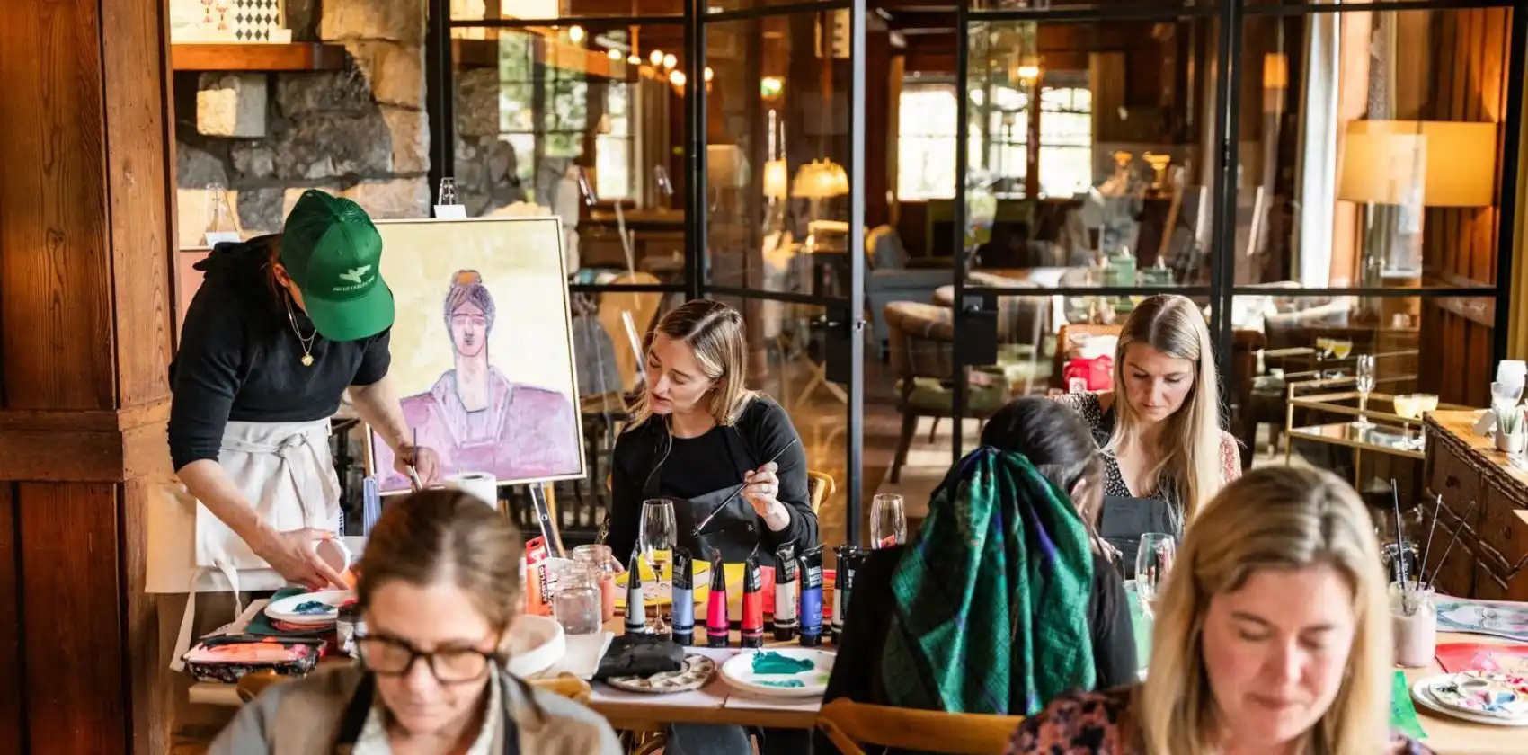 Artist leading a painting workshop