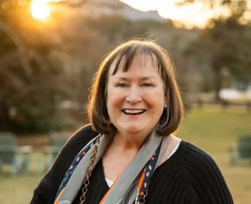 Headshot of Dana Lange, smiling outside