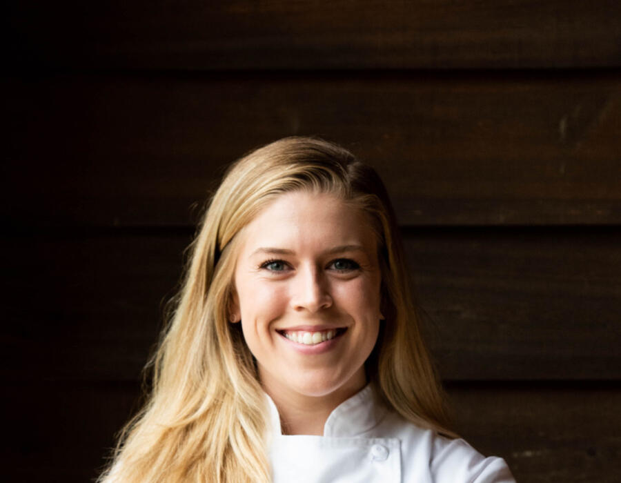 Chef April Franqueza smiling in chef's coat