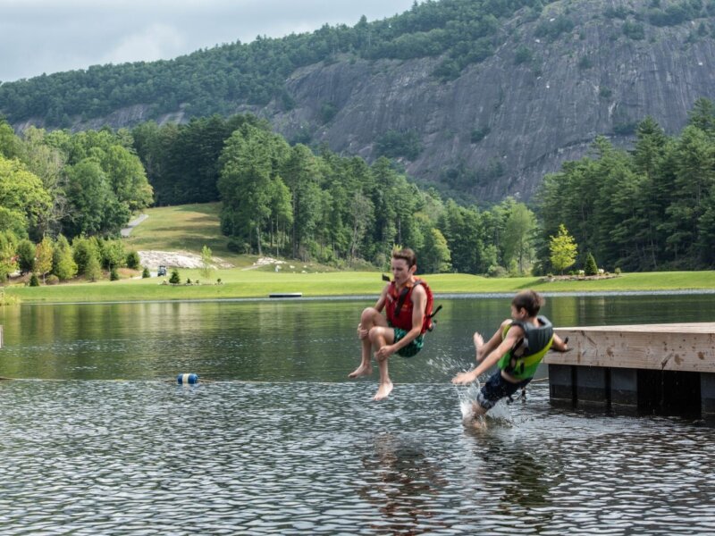 Two boys jump into Hampton Lake