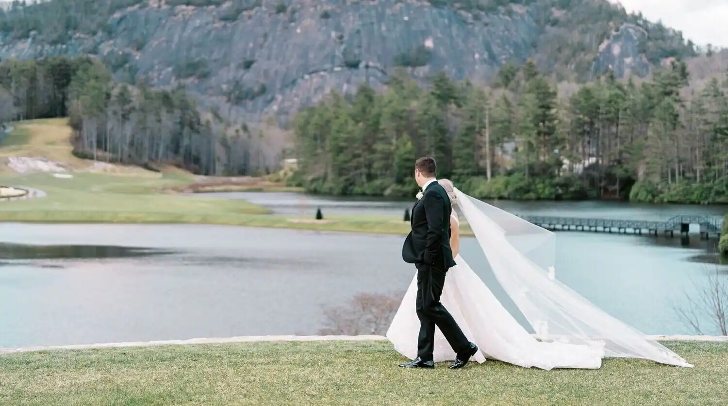 Bride and Groom Walking in front of Rock Mountain
