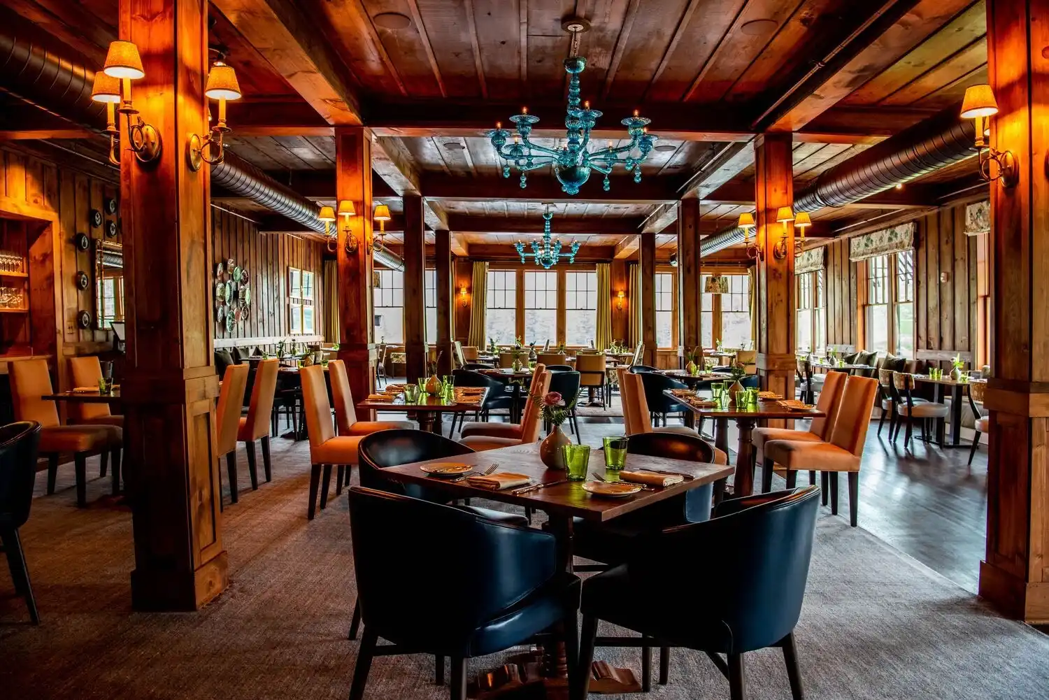 A dining room with several set tables