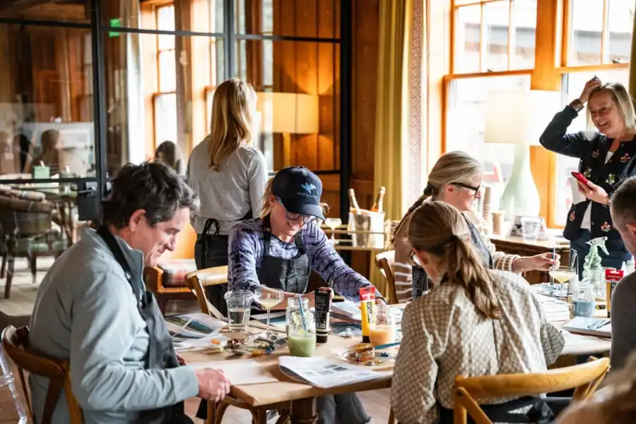 Men and Women Smiling at Painting Workshop
