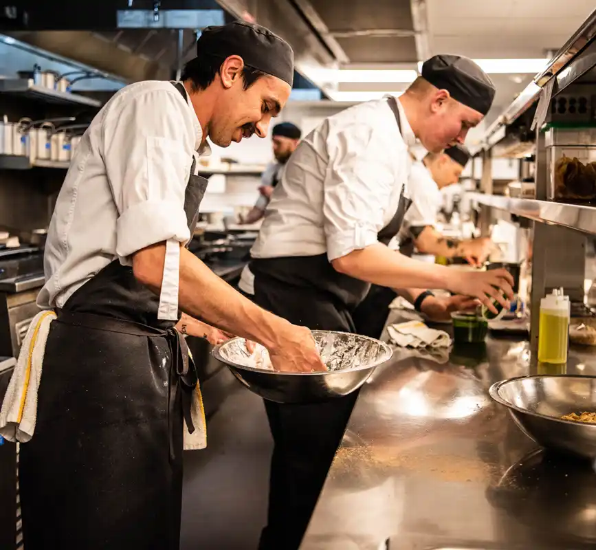 Line cooks preparing meals