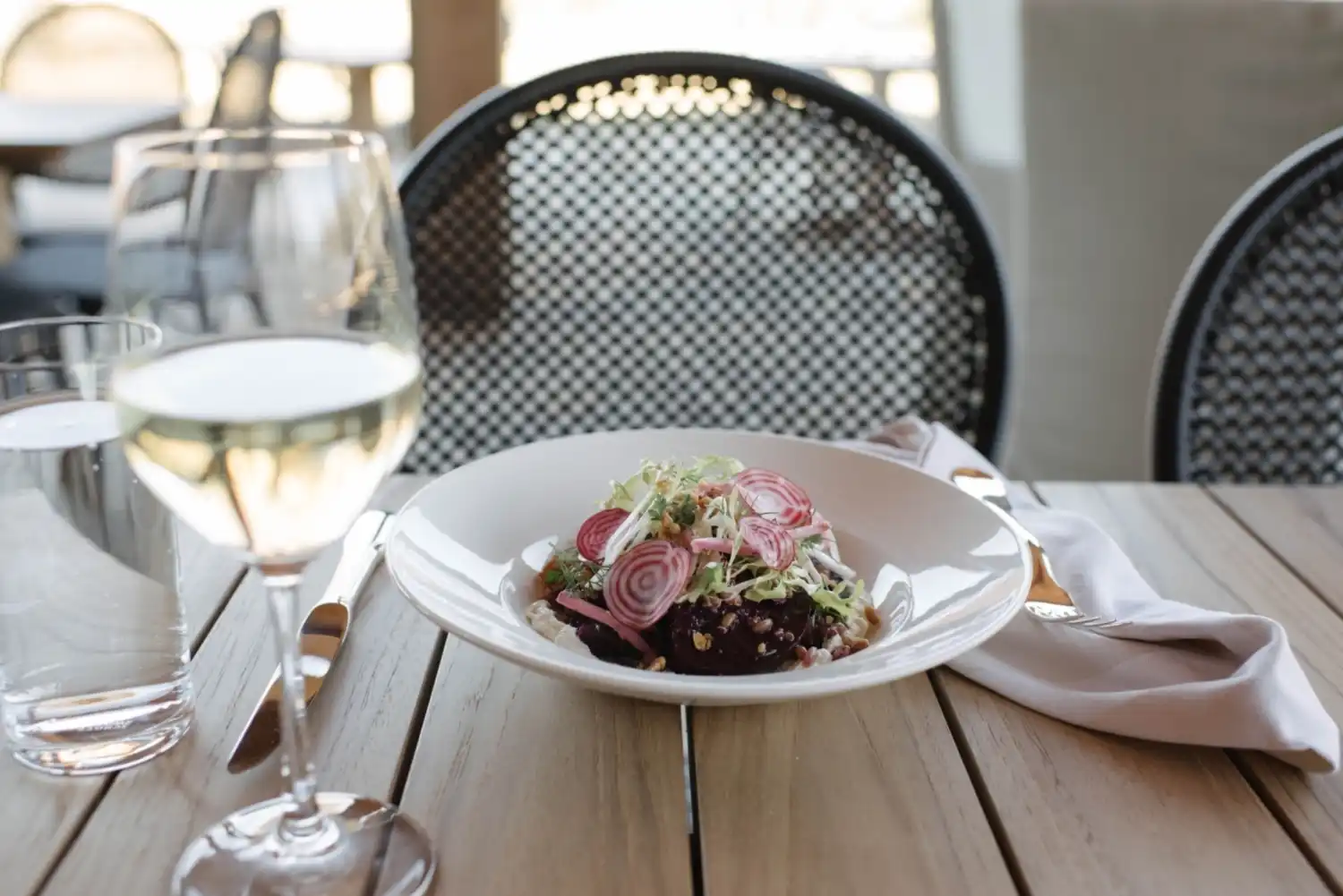 Salad and wine on a table