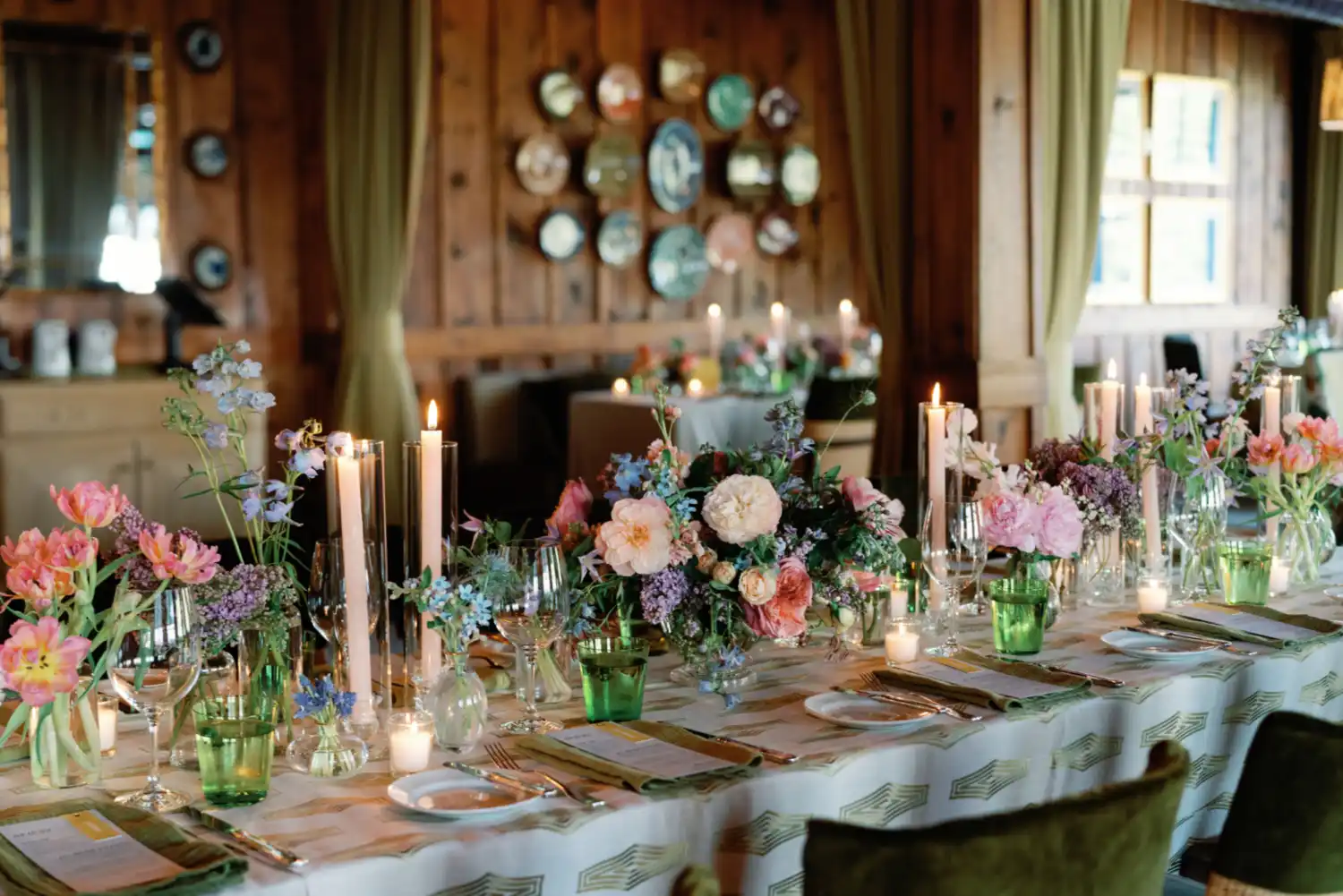 A table set with florals for a wedding reception