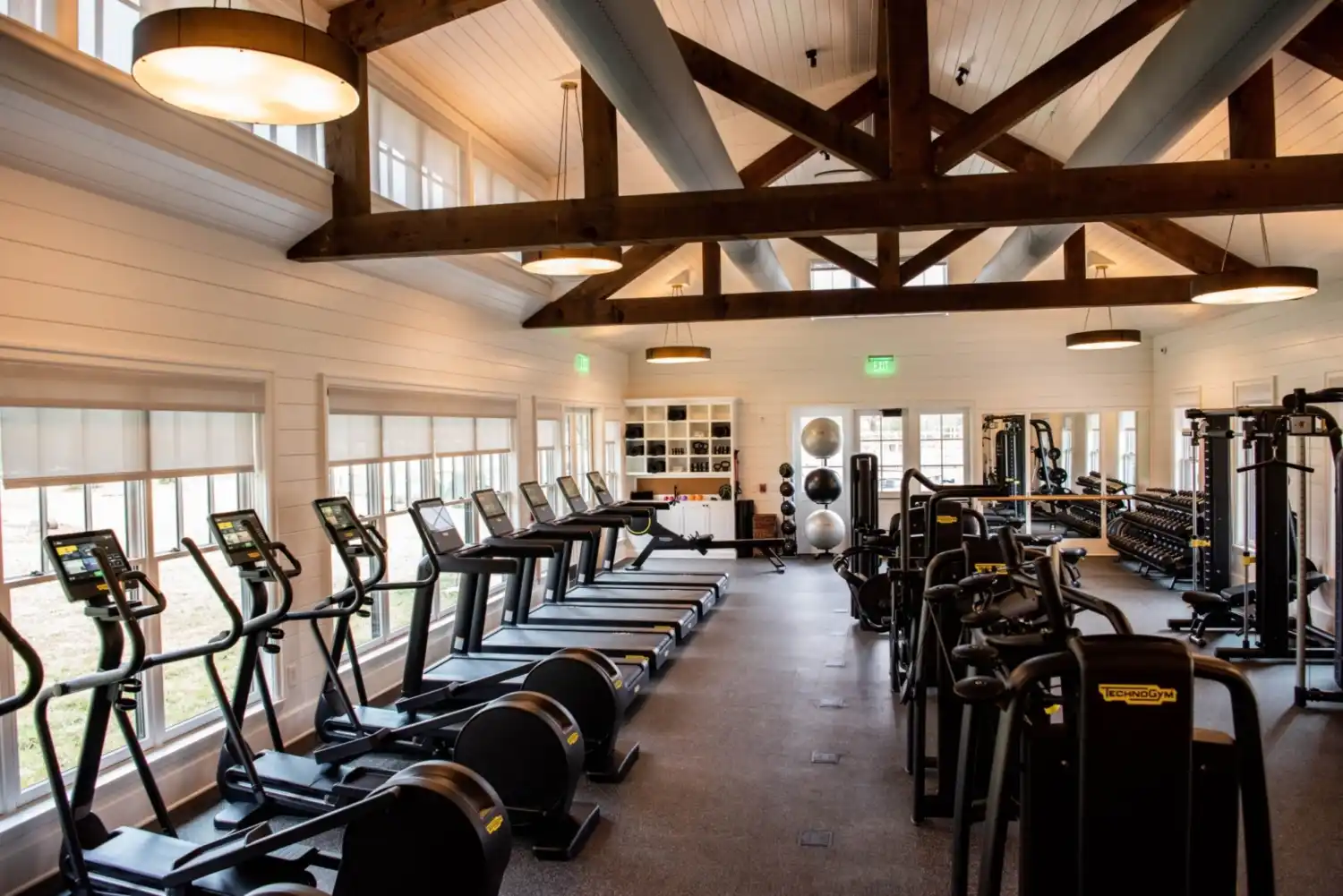 A row of treadmills and workout equipment in High Hampton's Fitness Center