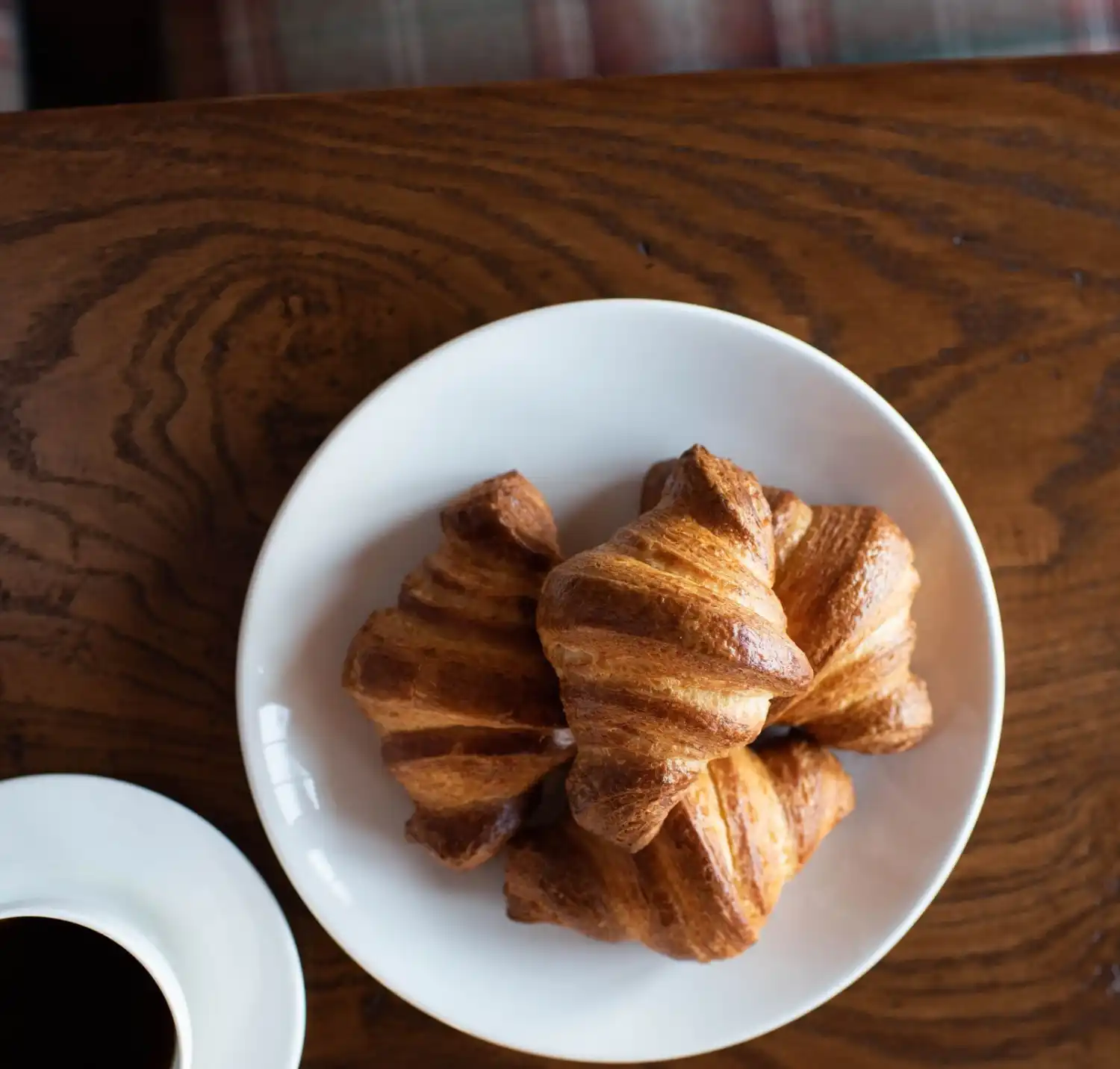 Freshly baked croissants on a plate