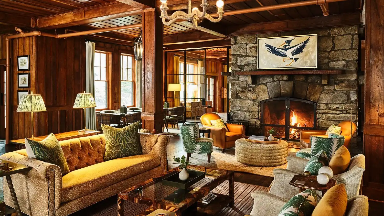 A warm lobby with a lit fireplace