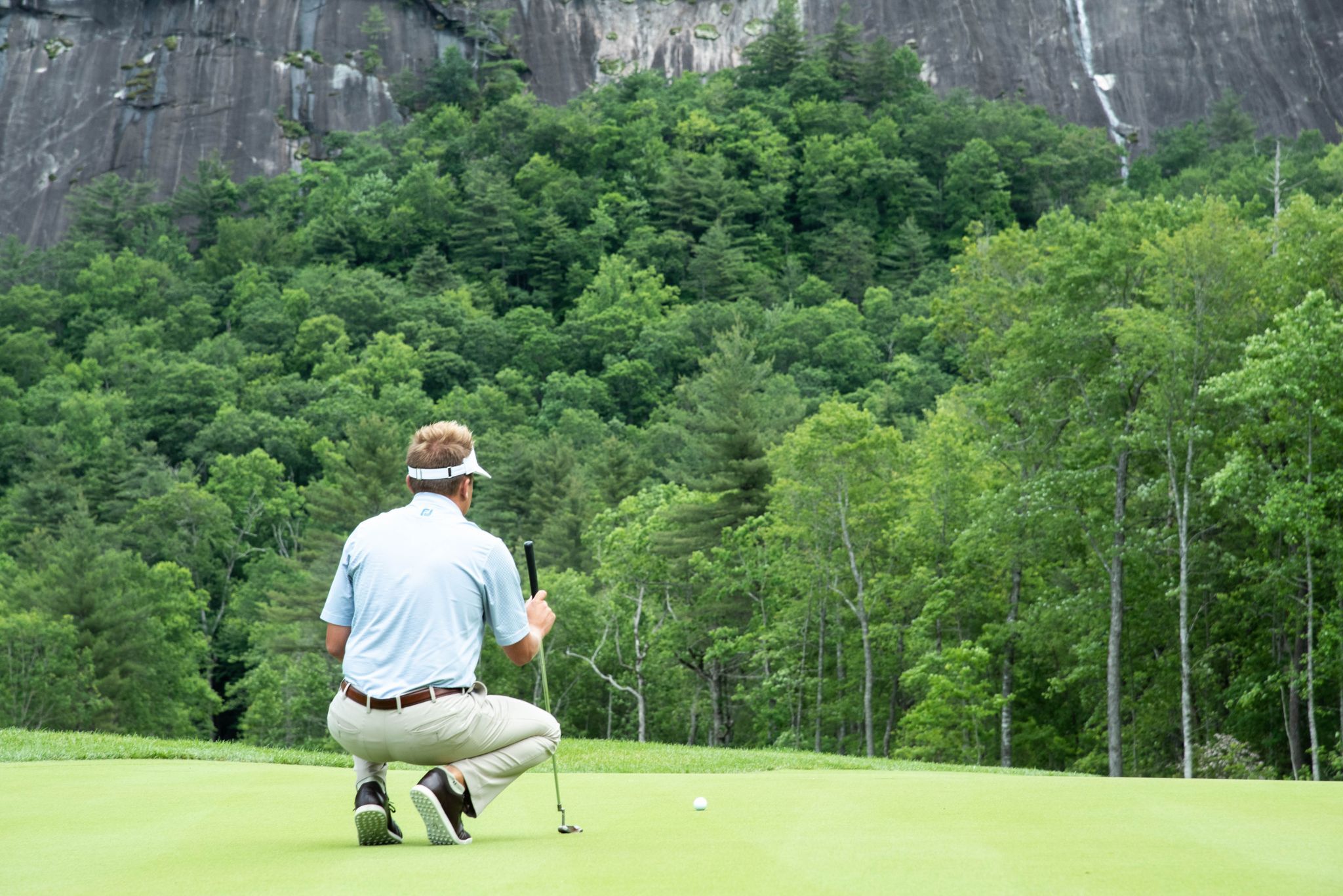 Person golfing on golf course